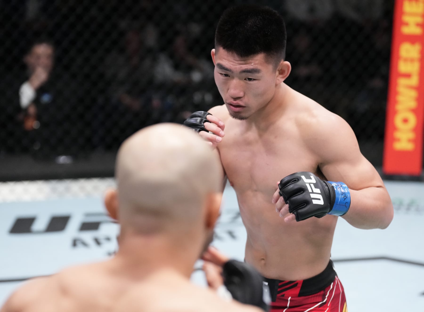 LAS VEGAS, NEVADA - MARCH 12: (R-L) Song Yadong of China battles Marlon Moraes of Brazil in their bantamweight fight during the UFC Fight Night event at UFC APEX on March 12, 2022 in Las Vegas, Nevada. (Photo by Chris Unger/Zuffa LLC)