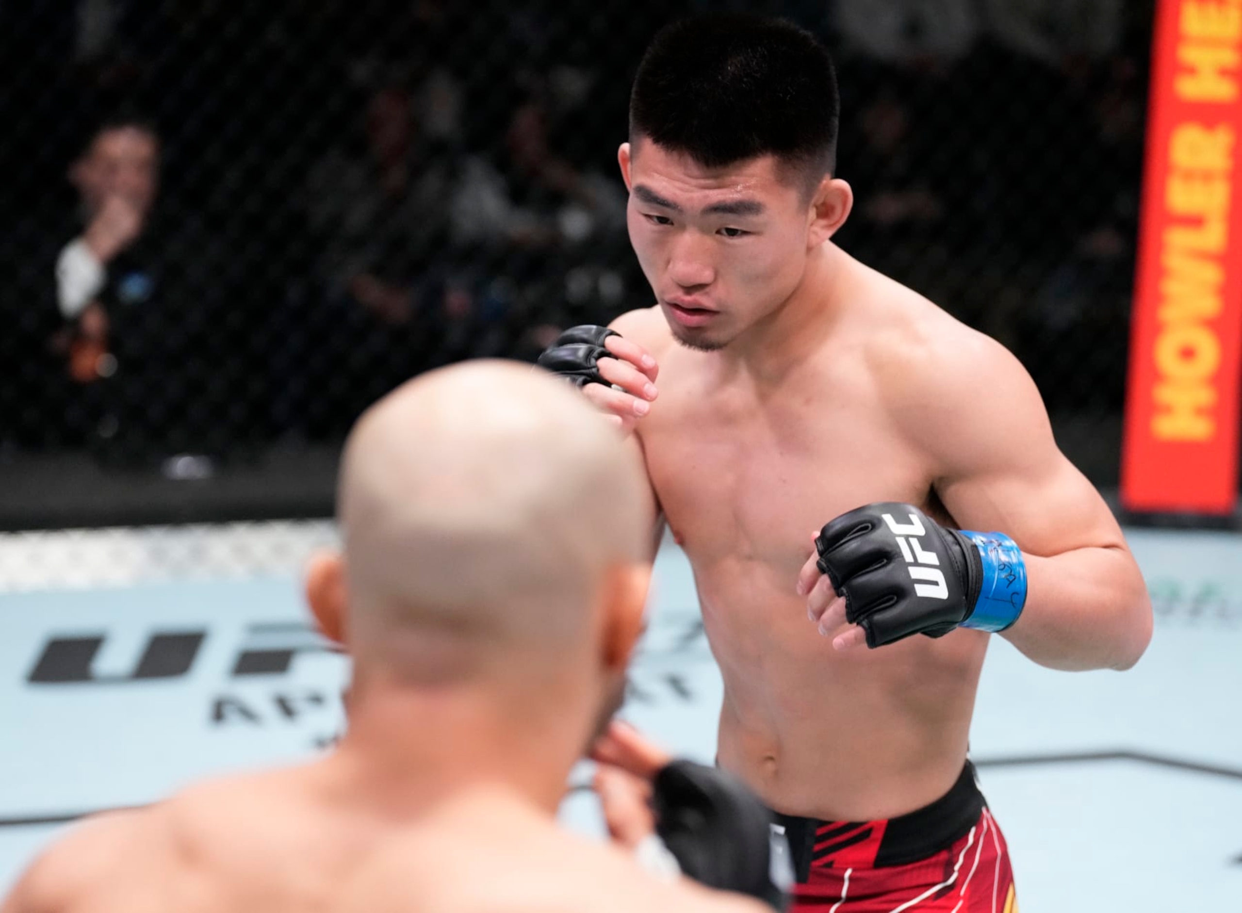 LAS VEGAS, NEVADA - MARCH 12: (R-L) Song Yadong of China battles Marlon Moraes of Brazil in their bantamweight fight during the UFC Fight Night event at UFC APEX on March 12, 2022 in Las Vegas, Nevada. (Photo by Chris Unger/Zuffa LLC)