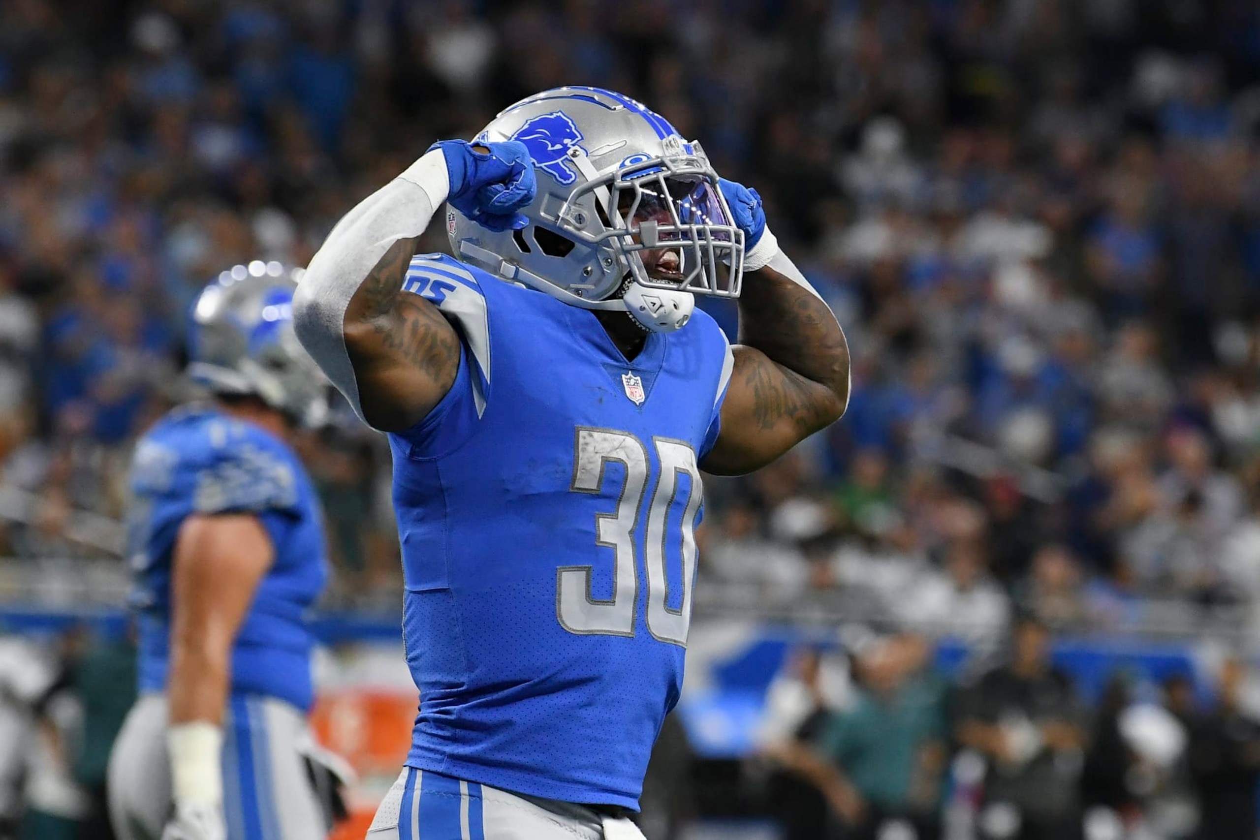 Detroit Lions running back Jamaal Williams celebrates his one-yard touchdown run against the Philadelphia Eagles in the first half of an NFL football game in Detroit, Sunday, Sept. 11, 2022. (AP Photo/Lon Horwedel)