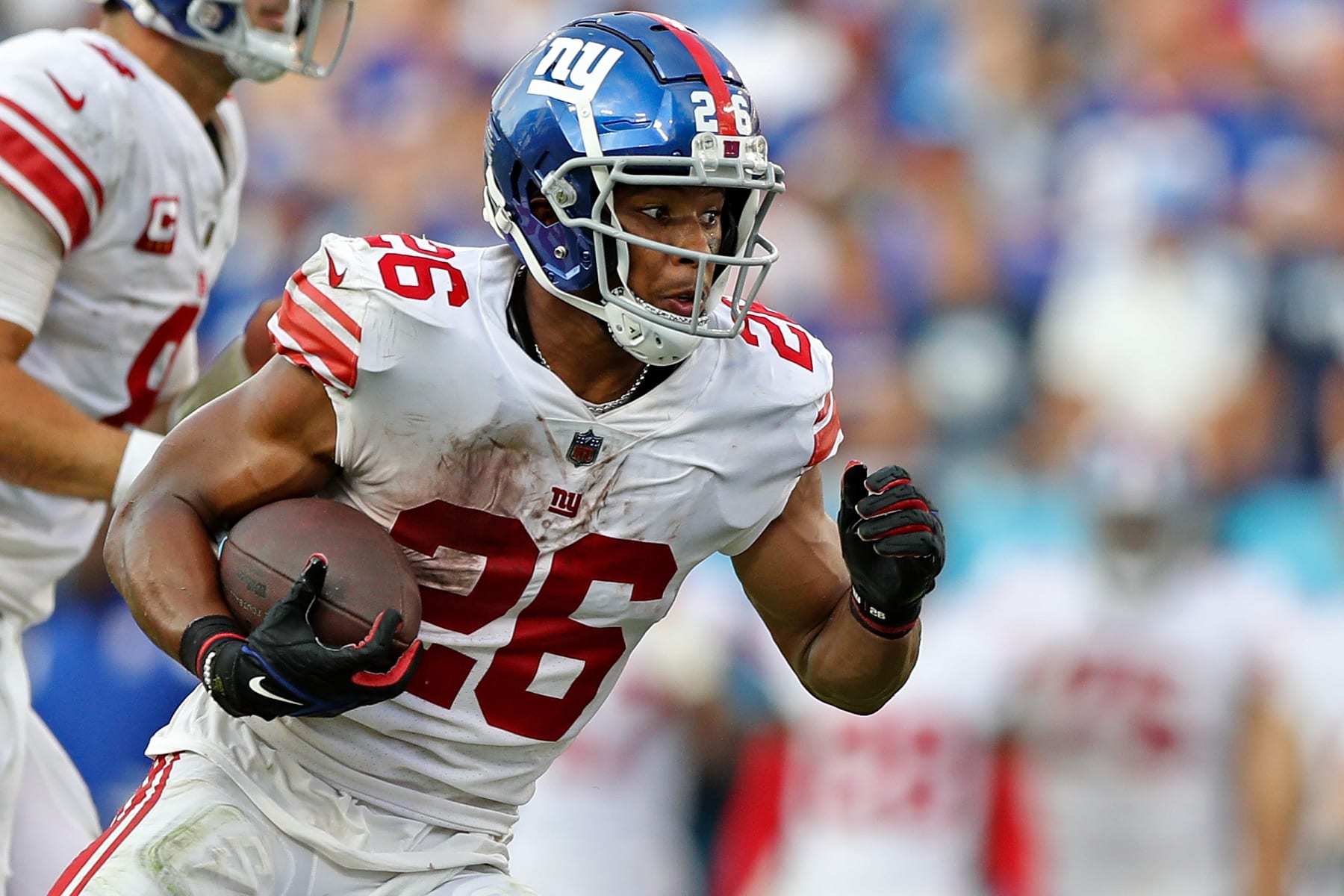NASHVILLE, TENNESSEE - SEPTEMBER 11: Saquon Barkley #26 of the New York Giants carries the ball during the game against the Tennessee Titans at Nissan Stadium on September 11, 2022 in Nashville, Tennessee. (Photo by Justin Ford/Getty Images)