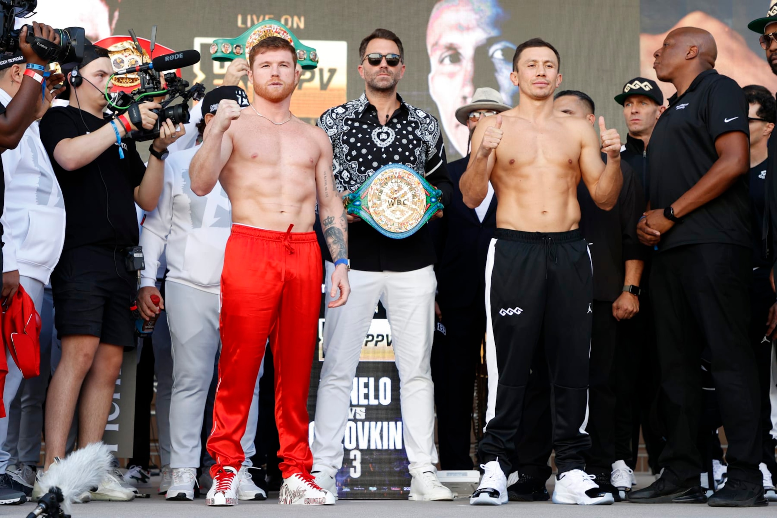 LAS VEGAS, NEVADA - SEPTEMBER 16: Canelo Alvarez of Mexico (L) and Gennadiy Golovkin of Kazakhstan (R) pose with Matchroom Sport Chairman Eddie Hearn (C) during their ceremonial weigh-in at Toshiba Plaza on September 16, 2022 in Las Vegas, Nevada. Alvarez and Golovkin will meet for their undisputed super middleweight title bout at T-Mobile Arena in Las Vegas on September 17. (Photo by Sarah Stier/Getty Images)