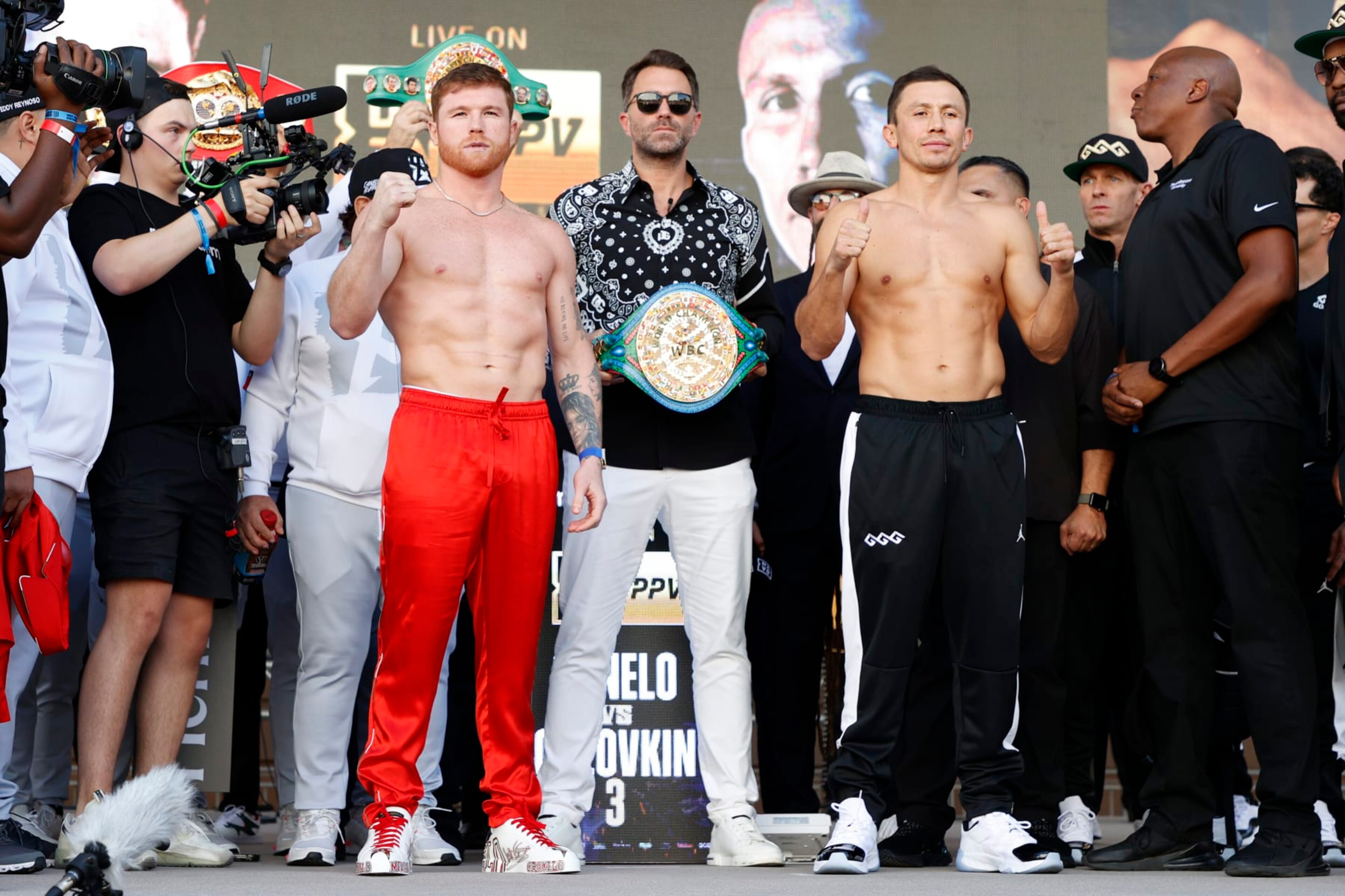 LAS VEGAS, NEVADA - SEPTEMBER 16: Canelo Alvarez of Mexico (L) and Gennadiy Golovkin of Kazakhstan (R) pose with Matchroom Sport Chairman Eddie Hearn (C) during their ceremonial weigh-in at Toshiba Plaza on September 16, 2022 in Las Vegas, Nevada. Alvarez and Golovkin will meet for their undisputed super middleweight title bout at T-Mobile Arena in Las Vegas on September 17. (Photo by Sarah Stier/Getty Images) LAS VEGAS, NEVADA - SEPTEMBER 16: Canelo Alvarez of Mexico (L) and Gennadiy Golovkin of Kazakhstan (R) pose with Matchroom Sport Chairman Eddie Hearn (C) during their ceremonial weigh-in at Toshiba Plaza on September 16, 2022 in Las Vegas, Nevada. Alvarez and Golovkin will meet for their undisputed super middleweight title bout at T-Mobile Arena in Las Vegas on September 17. (Photo by Sarah Stier/Getty Images)