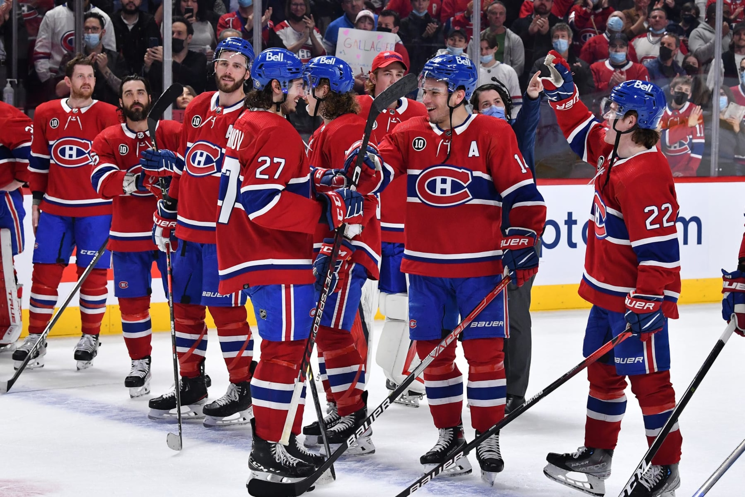 MONTREAL, QC - APRIL 29: Nick Suzuki #14, Cole Caufield #22  and Alexander Romanov #27 of the Montreal Canadiens celebrate after defeating the Florida Panthers in the NHL game at the Bell Centre on April 29, 2022 in Montreal, Quebec, Canada. (Photo by Francois Lacasse/NHLI via Getty Images) *** Local Caption ***