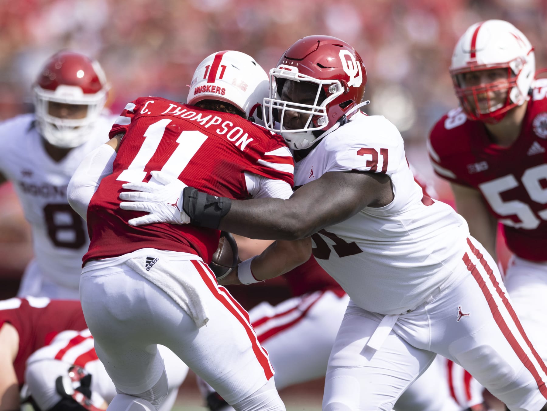Oklahoma's Jalen Redmond (31) sacks Nebraska quarterback Casey Thompson (11) during the first half of an NCAA college football game Saturday, Sept. 17, 2022, in Lincoln, Neb. (AP Photo/Rebecca S. Gratz)