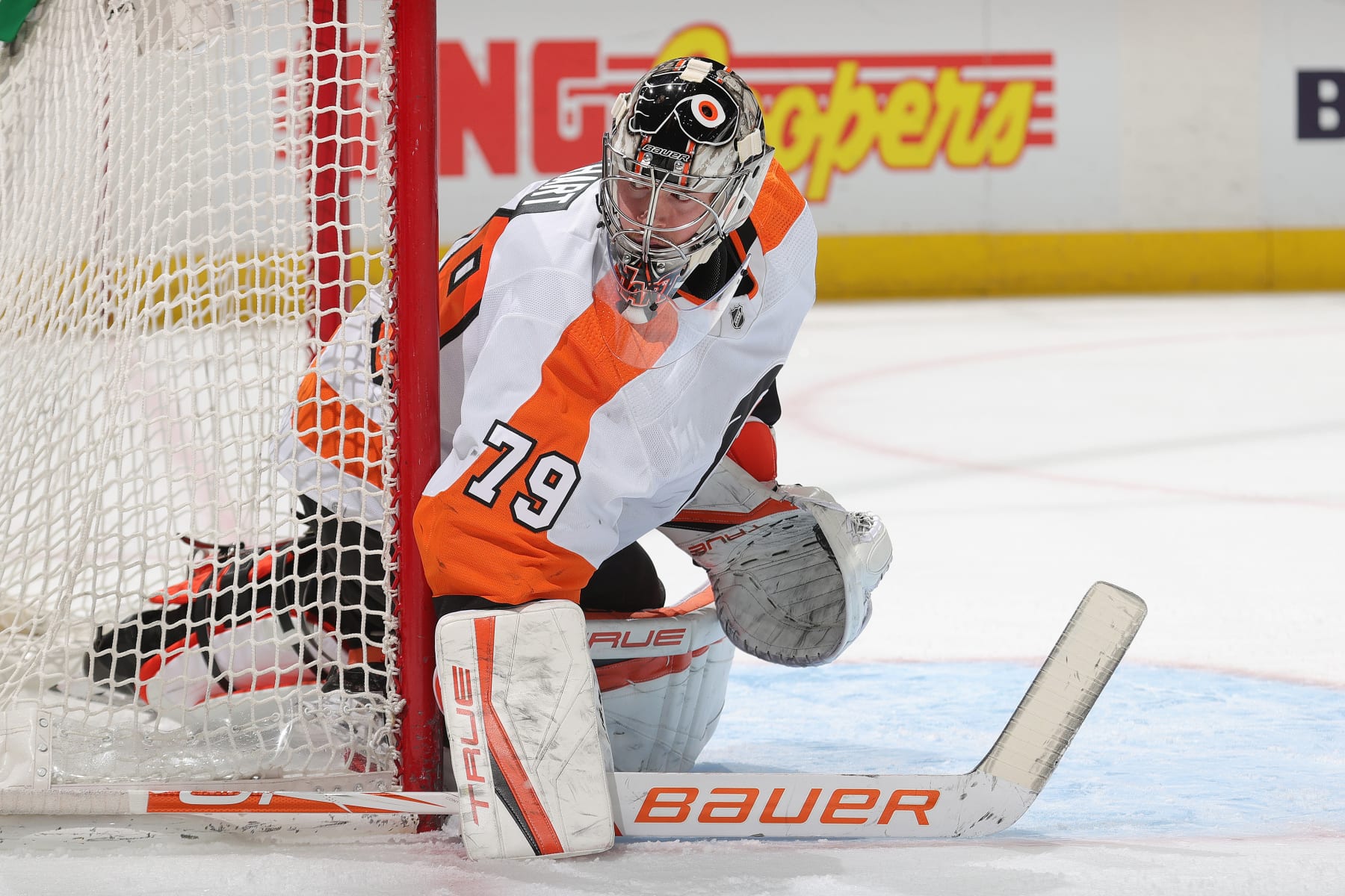 DENVER, COLORADO - MARCH 25: Goaltender Carter Hart #79 of the Philadelphia Flyers eyes the puck against the Colorado Avalanche at Ball Arena on March 25, 2022 in Denver, Colorado. (Photo by Michael Martin/NHLI via Getty Images)