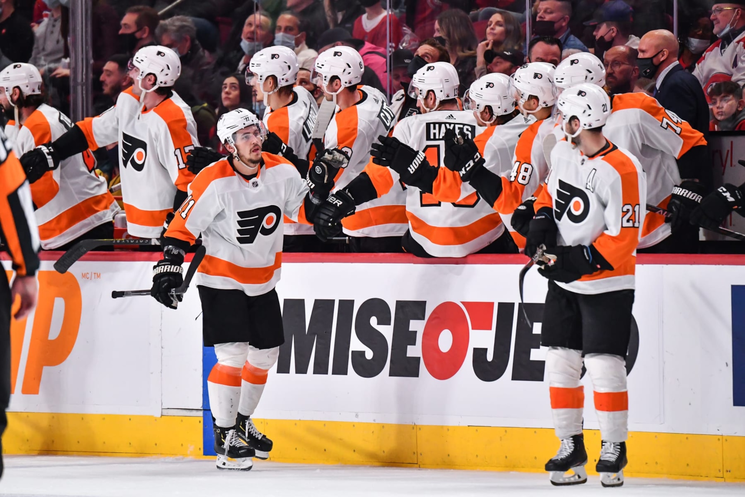 MONTREAL, QC - APRIL 21:  Travis Konecny #11 of the Philadelphia Flyers celebrates his goal with teammates on the bench during the second period against the Montreal Canadiens at Centre Bell on April 21, 2022 in Montreal, Canada.  (Photo by Minas Panagiotakis/Getty Images)