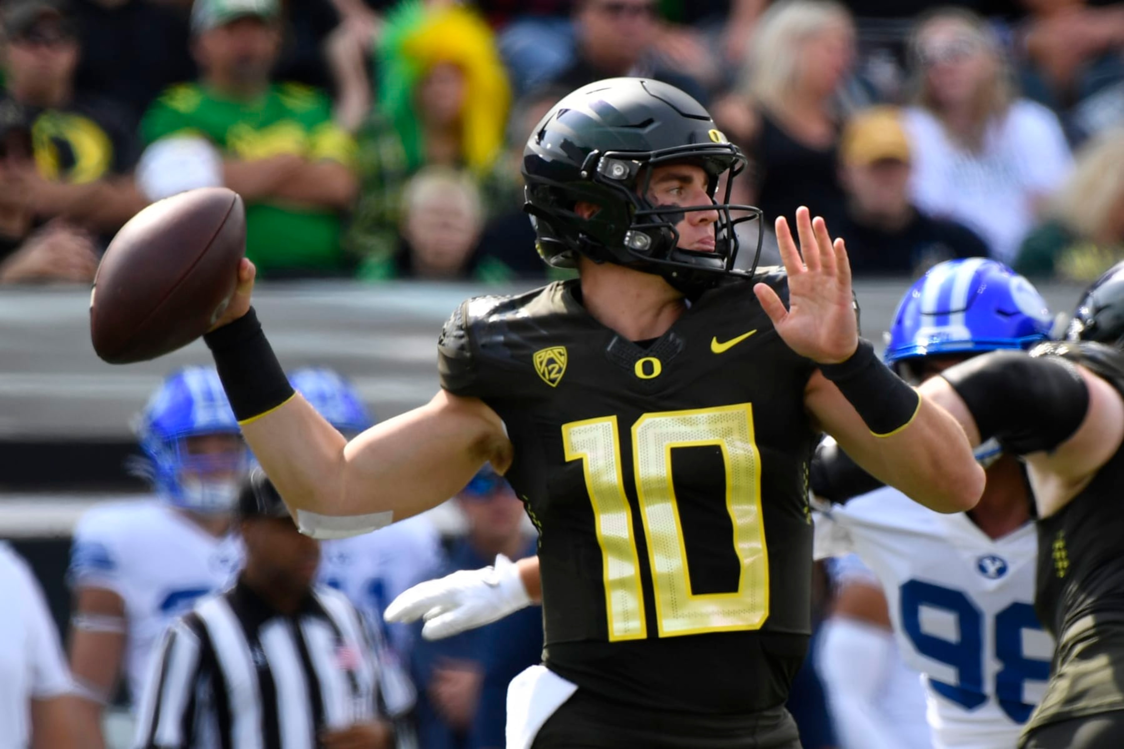Oregon quarterback Bo Nix (10) looks to throw against BYU during the first half of an NCAA college football game Saturday, Sept. 17, 2022, in Eugene, Ore. (AP Photo/Andy Nelson) Oregon quarterback Bo Nix (10) looks to throw against BYU during the first half of an NCAA college football game Saturday, Sept. 17, 2022, in Eugene, Ore. (AP Photo/Andy Nelson)