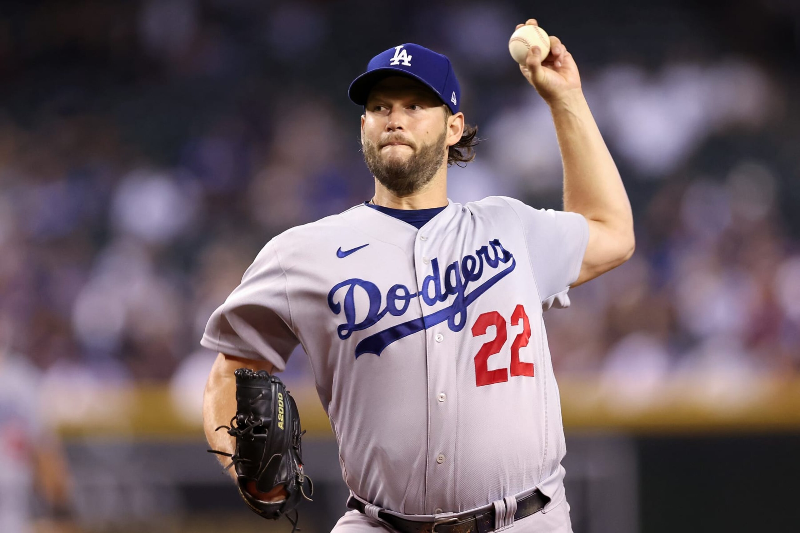 PHOENIX, ARIZONA - SEPTEMBER 13: Starting pitcher Clayton Kershaw #22 of the Los Angeles Dodgers throws a warm-up pitch during the first inning of the MLB game against the Arizona Diamondbacks at Chase Field on September 13, 2022 in Phoenix, Arizona. (Photo by Christian Petersen/Getty Images)