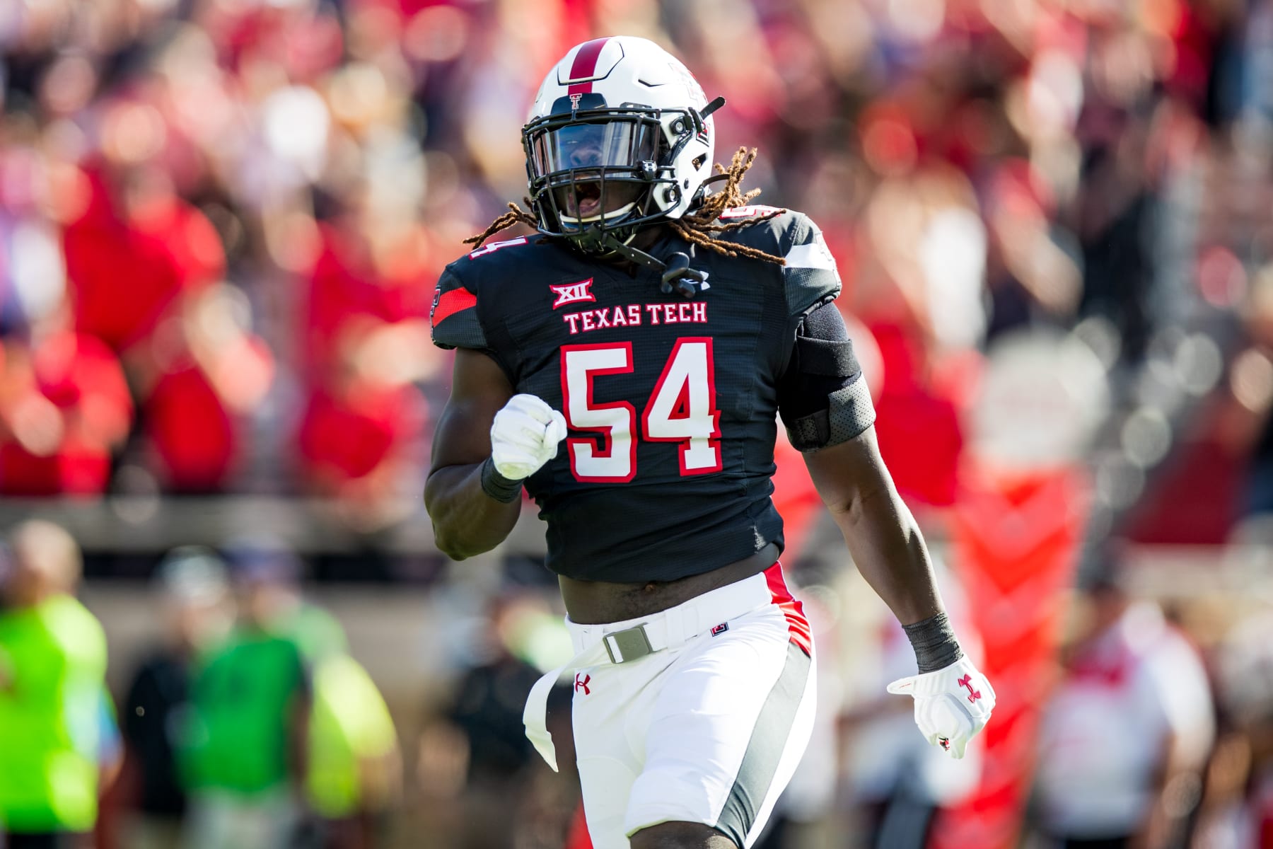 LUBBOCK, TEXAS - OCTOBER 23: Linebacker Bryce Ramirez #54 of the Texas Tech Red Raiders reacts after the Red Raiders recoverd a fumble during the first half of the college football game against the Kansas State Wildcats at Jones AT&T Stadium on October 23, 2021 in Lubbock, Texas. (Photo by John E. Moore III/Getty Images)