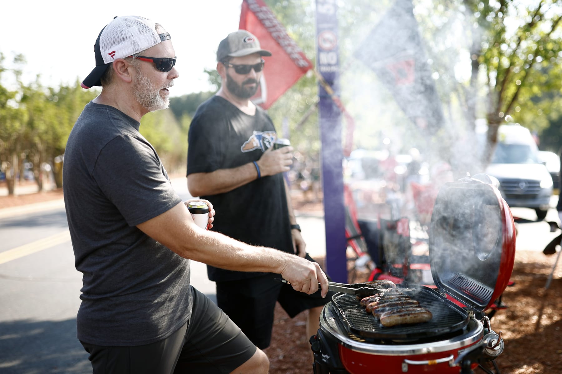 RALEIGH, NORTH CAROLINA - MAY 30: Fans tailgate prior to Game Seven of the Second Round of the 2022 Stanley Cup Playoffs between the Carolina Hurricanes and the New York Rangers at PNC Arena on May 30, 2022 in Raleigh, North Carolina. (Photo by Jared C. Tilton/Getty Images)