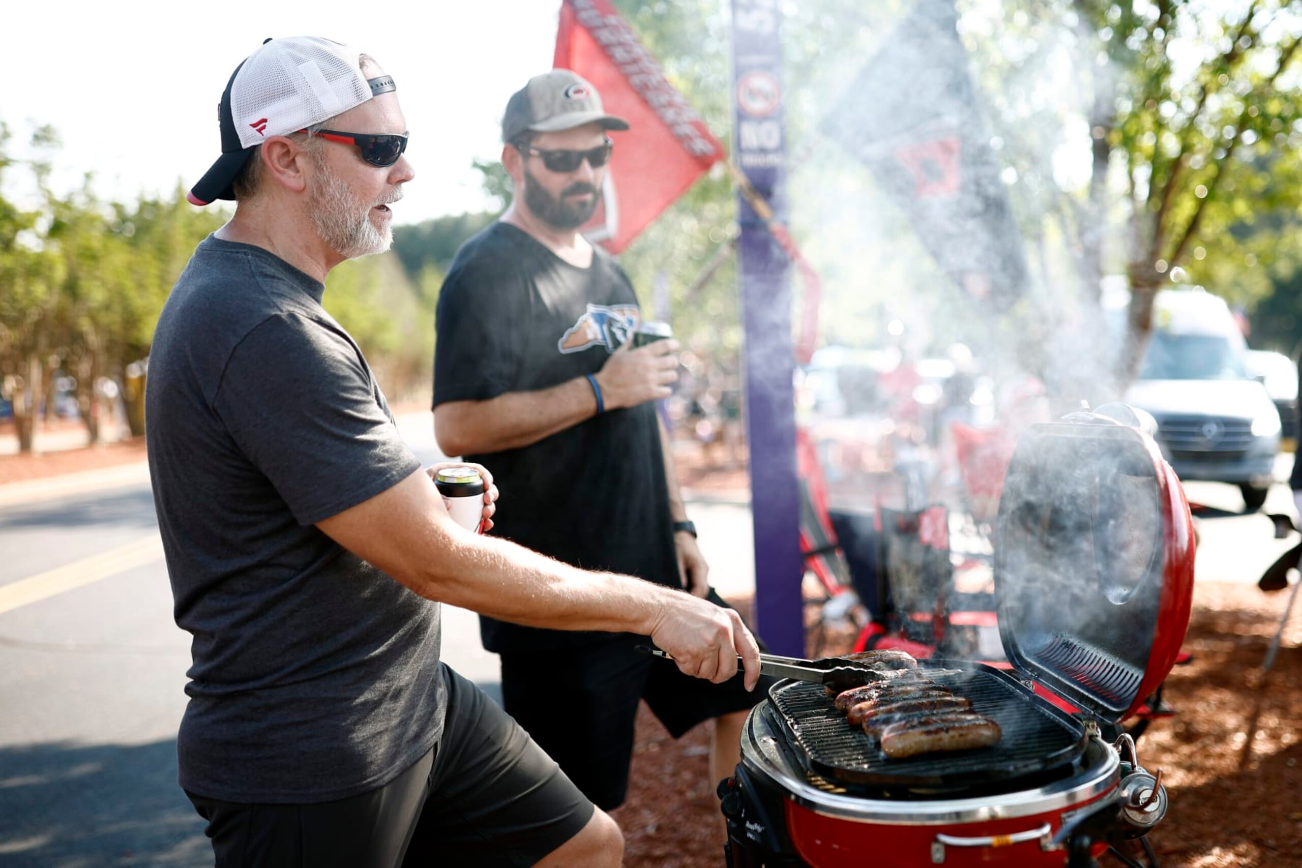 RALEIGH, NORTH CAROLINA - MAY 30: Fans tailgate prior to Game Seven of the Second Round of the 2022 Stanley Cup Playoffs between the Carolina Hurricanes and the New York Rangers at PNC Arena on May 30, 2022 in Raleigh, North Carolina. (Photo by Jared C. Tilton/Getty Images)