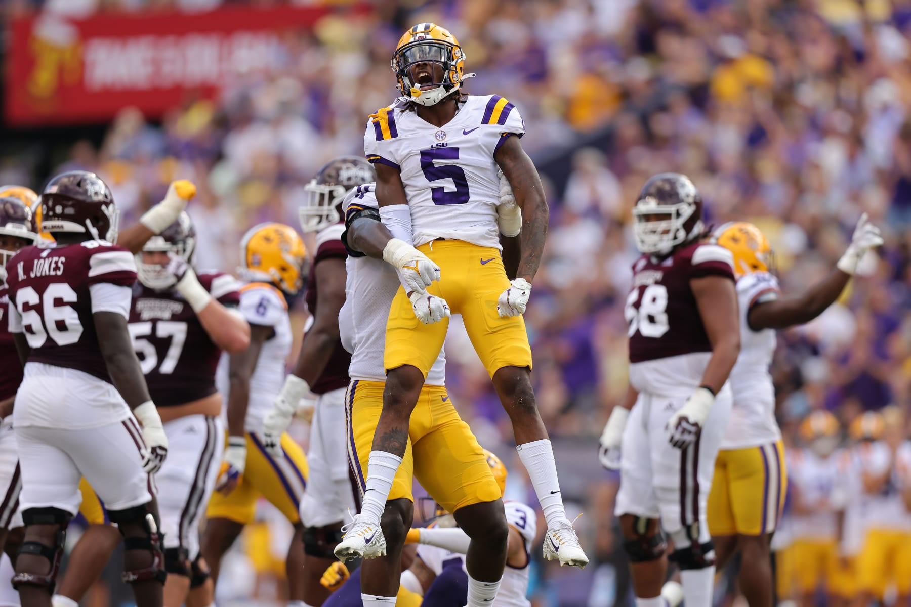 BATON ROUGE, LOUISIANA - SEPTEMBER 17: Jay Ward #5 of the LSU Tigers celebrates a tackle during the first half of a game against the Mississippi State Bulldogs at Tiger Stadium on September 17, 2022 in Baton Rouge, Louisiana. (Photo by Jonathan Bachman/Getty Images)