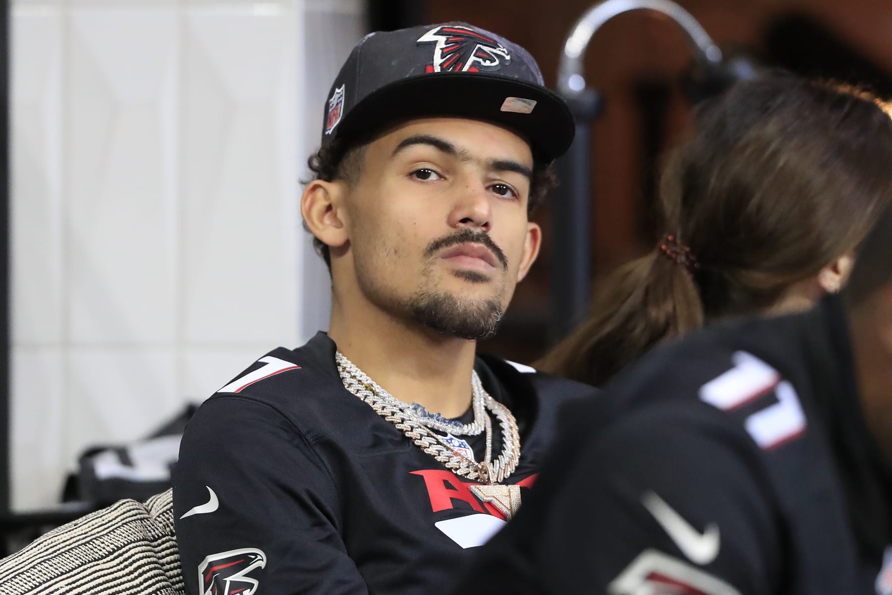 ATLANTA, GA - SEPTEMBER 11: Atlanta Hawks basketball star Trae Young watches the game from a field level suite during the Week 1 NFL game between the New Orleans Saints and the Atlanta Falcons on Septermber 11, 2022 at the Mercedes-Benz Stadium in Atlanta, Georgia.(Photo by David J. Griffin/Icon Sportswire via Getty Images)