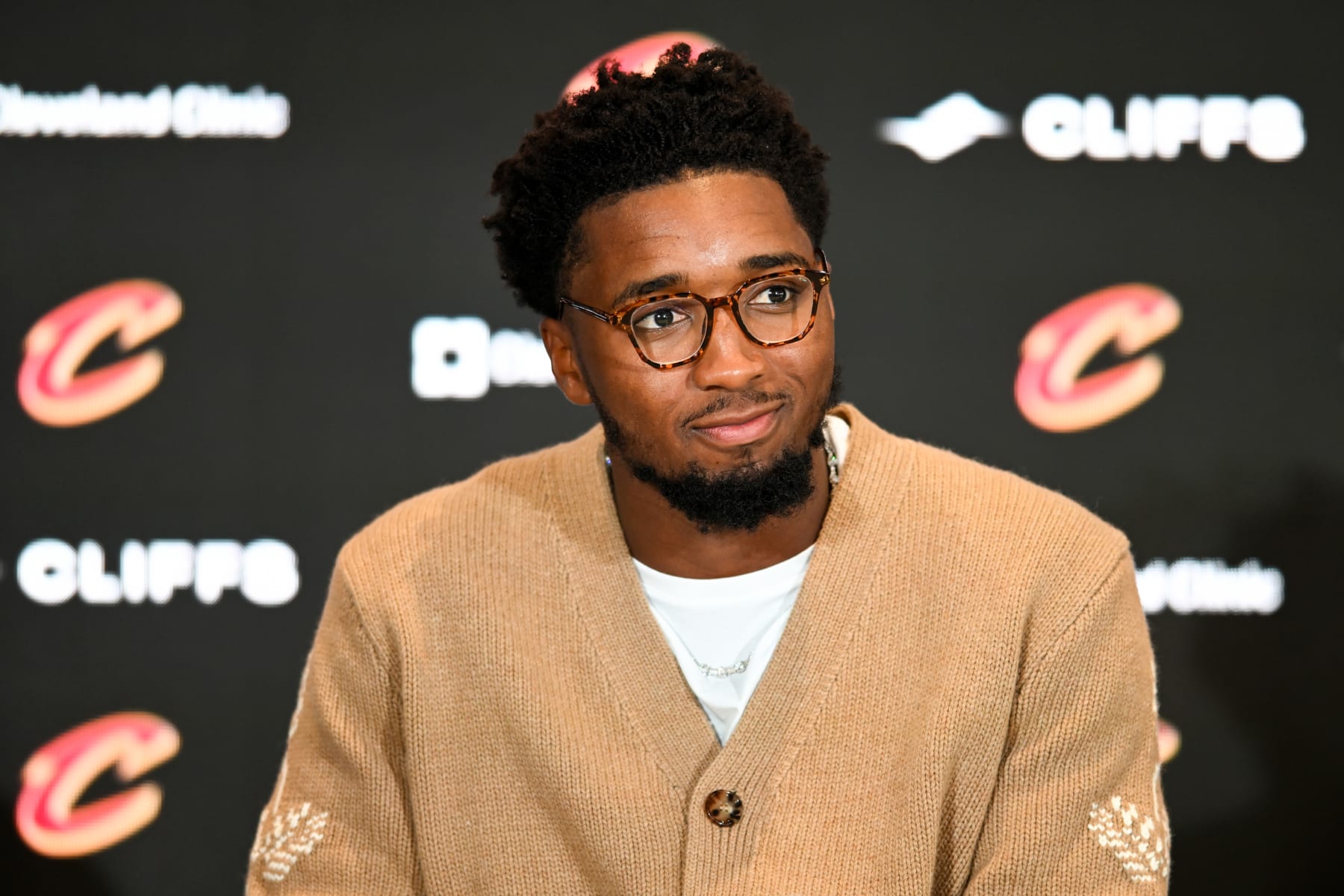 CLEVELAND, OHIO - SEPTEMBER 14: Donovan Mitchell listens to questions during a press conference where he was introduced at Rocket Mortgage Fieldhouse on September 14, 2022 in Cleveland, Ohio. NOTE TO USER: User expressly acknowledges and agrees that, by downloading and or using this Photograph, User is consenting to the terms and conditions of the Getty Images License Agreement. (Photo by Nick Cammett/Getty Images)