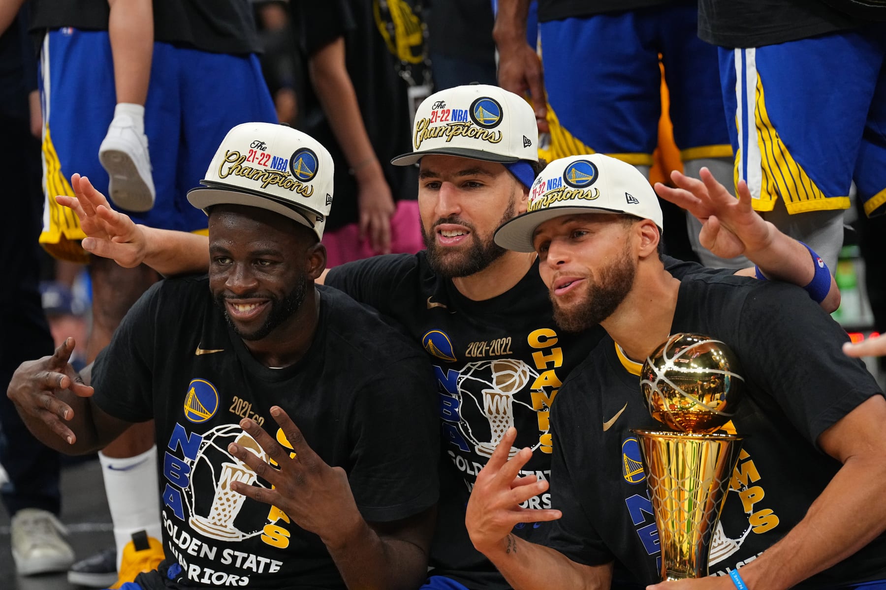 BOSTON, MA - JUNE 16: Draymond Green #23, Klay Thompson #11 and Stephen Curry #30 of the Golden State Warriors smile and celebrates on stage with he Bill Russell Finals MVP Trophy after winning Game Six of the 2022 NBA Finals against the Boston Celtics on June 16, 2022 at TD Garden in Boston, Massachusetts. NOTE TO USER: User expressly acknowledges and agrees that, by downloading and or using this photograph, user is consenting to the terms and conditions of Getty Images License Agreement. Mandatory Copyright Notice: Copyright 2022 NBAE (Photo by Garrett Ellwood/NBAE via Getty Images)