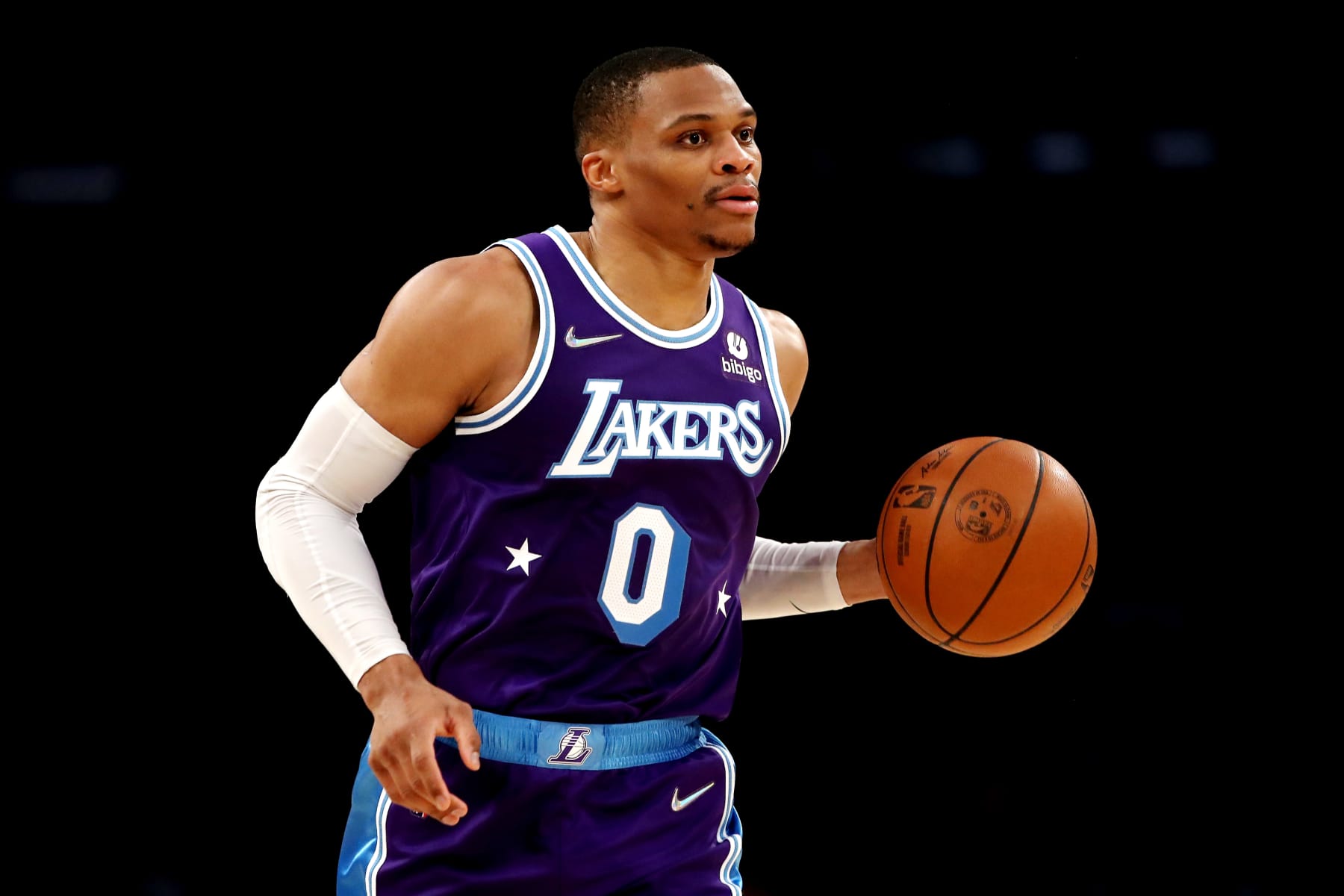 LOS ANGELES, CALIFORNIA - DECEMBER 31: Russell Westbrook #0 of the Los Angeles Lakers brings the ball up court during the third quarter against the Portland Trail Blazers at Crypto.com Arena on December 31, 2021 in Los Angeles, California. NOTE TO USER: User expressly acknowledges and agrees that, by downloading and or using this photograph, User is consenting to the terms and conditions of the Getty Images License Agreement. (Photo by Katelyn Mulcahy/Getty Images)
