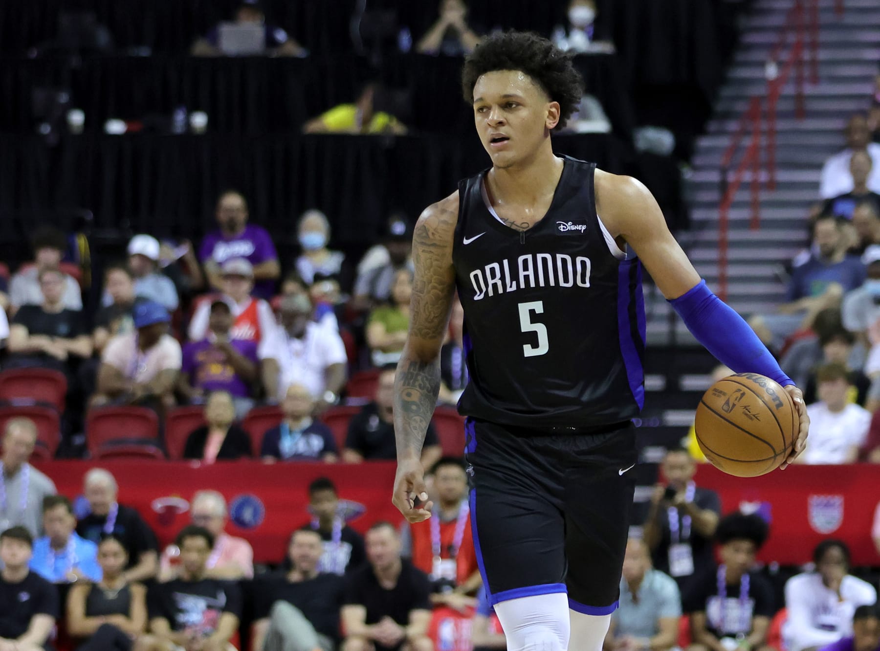 LAS VEGAS, NEVADA - JULY 09: Paolo Banchero #5 of the Orlando Magic brings the ball up the court against the Sacramento Kings during the 2022 NBA Summer League at the Thomas & Mack Center on July 09, 2022 in Las Vegas, Nevada. NOTE TO USER: User expressly acknowledges and agrees that, by downloading and or using this photograph, User is consenting to the terms and conditions of the Getty Images License Agreement. (Photo by Ethan Miller/Getty Images)
