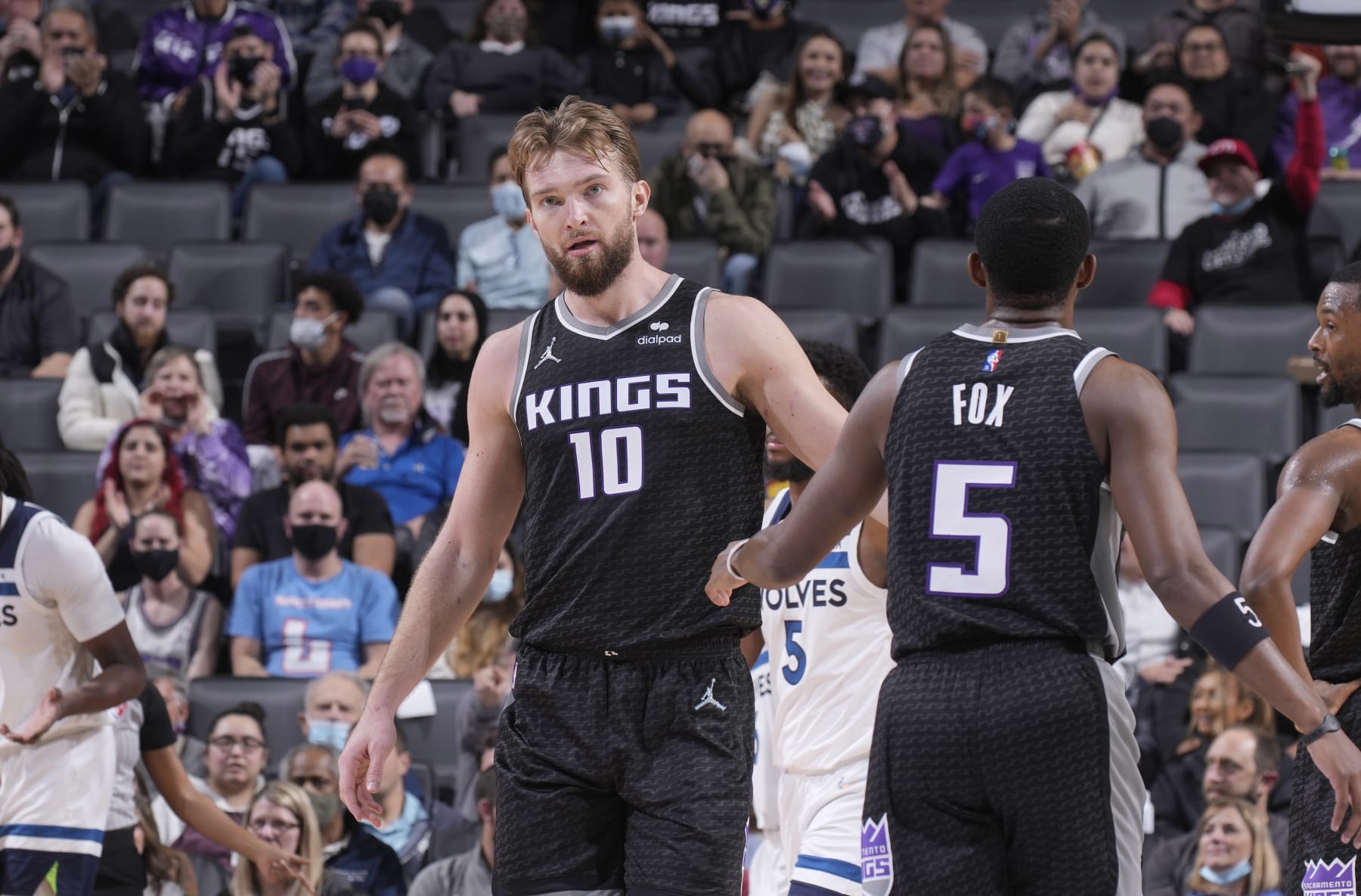 SACRAMENTO, CA - FEBRUARY 9: Domantas Sabonis #10 and De'Aaron Fox #5 of the Sacramento Kings high five during the game against the Minnesota Timberwolves on February 9, 2022 at Golden 1 Center in Sacramento, California. NOTE TO USER: User expressly acknowledges and agrees that, by downloading and or using this photograph, User is consenting to the terms and conditions of the Getty Images Agreement. Mandatory Copyright Notice: Copyright 2022 NBAE (Photo by Rocky Widner/NBAE via Getty Images)