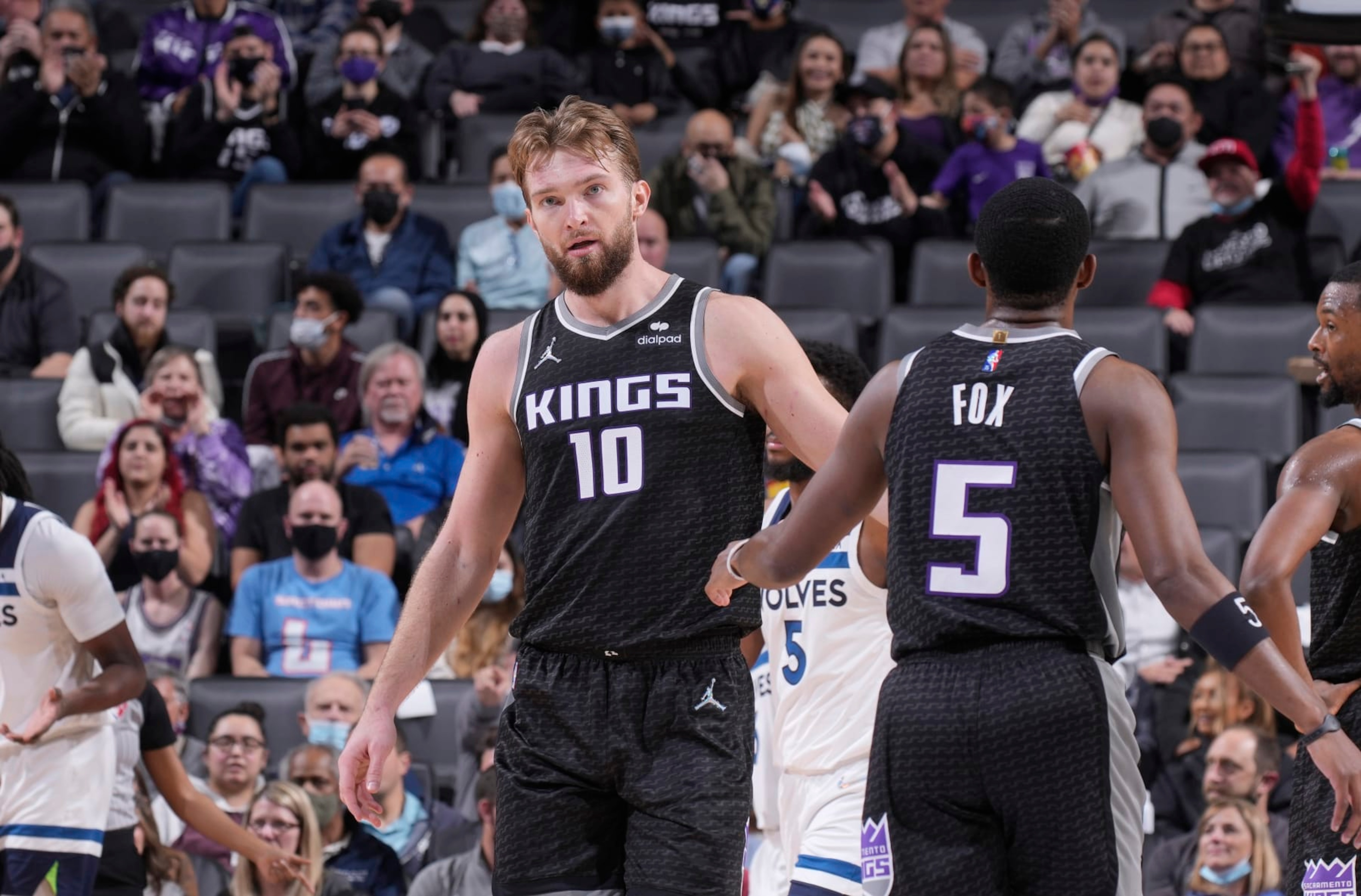 SACRAMENTO, CA - FEBRUARY 9: Domantas Sabonis #10 and De'Aaron Fox #5 of the Sacramento Kings high five during the game against the Minnesota Timberwolves on February 9, 2022 at Golden 1 Center in Sacramento, California. NOTE TO USER: User expressly acknowledges and agrees that, by downloading and or using this photograph, User is consenting to the terms and conditions of the Getty Images Agreement. Mandatory Copyright Notice: Copyright 2022 NBAE (Photo by Rocky Widner/NBAE via Getty Images)