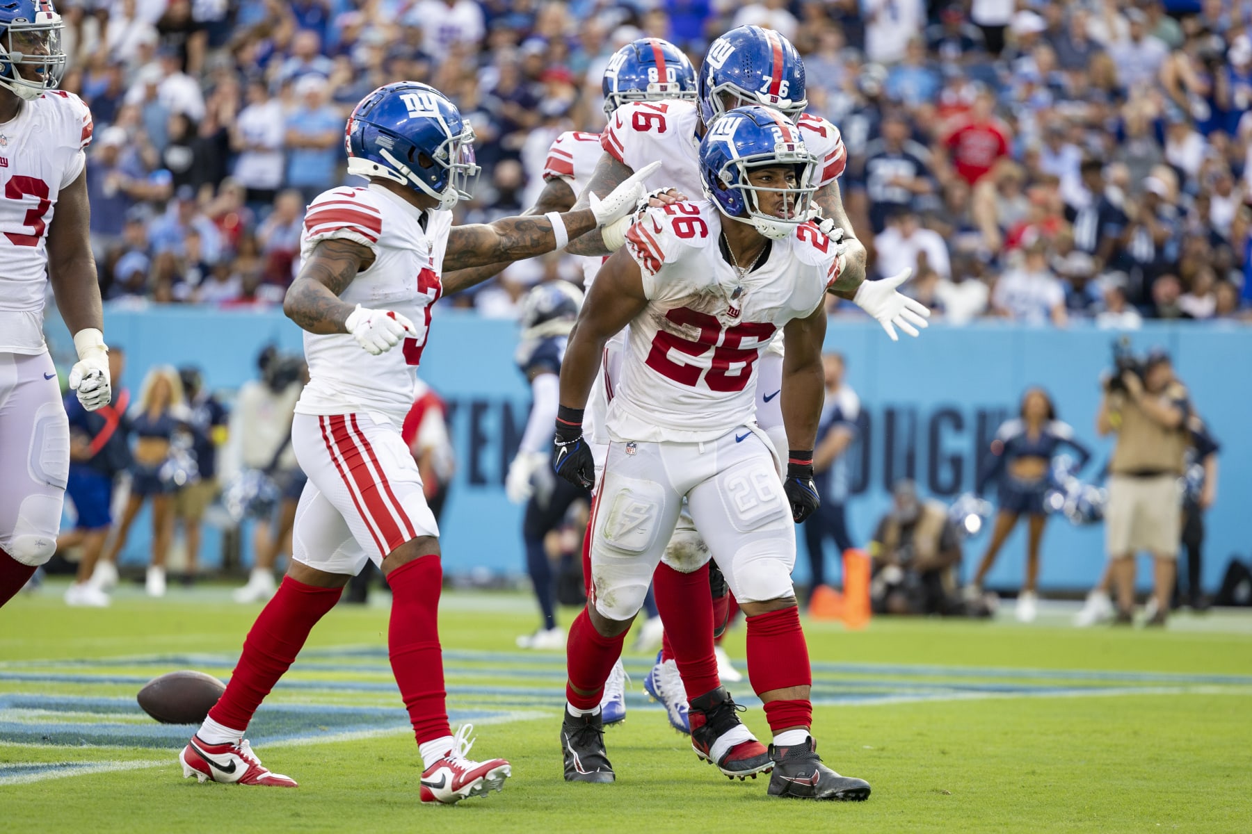 NASHVILLE, TENNESSEE - SEPTEMBER 11: Saquon Barkley #26 of the New York Giants celebrates after a big run during a game against the Tennessee Titans at Nissan Stadium on September 11, 2022 in Nashville, Tennessee. The Giants defeated the Titans 21-20.  (Photo by Wesley Hitt/Getty Images)