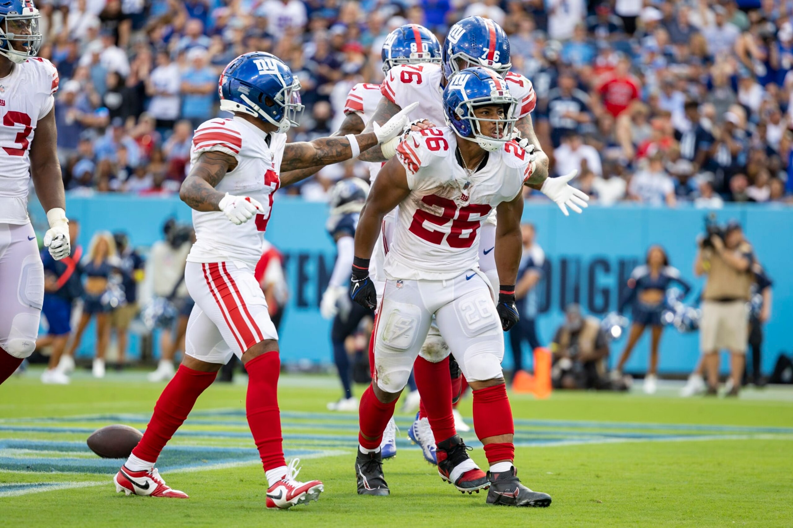NASHVILLE, TENNESSEE - SEPTEMBER 11: Saquon Barkley #26 of the New York Giants celebrates after a big run during a game against the Tennessee Titans at Nissan Stadium on September 11, 2022 in Nashville, Tennessee. The Giants defeated the Titans 21-20.  (Photo by Wesley Hitt/Getty Images)