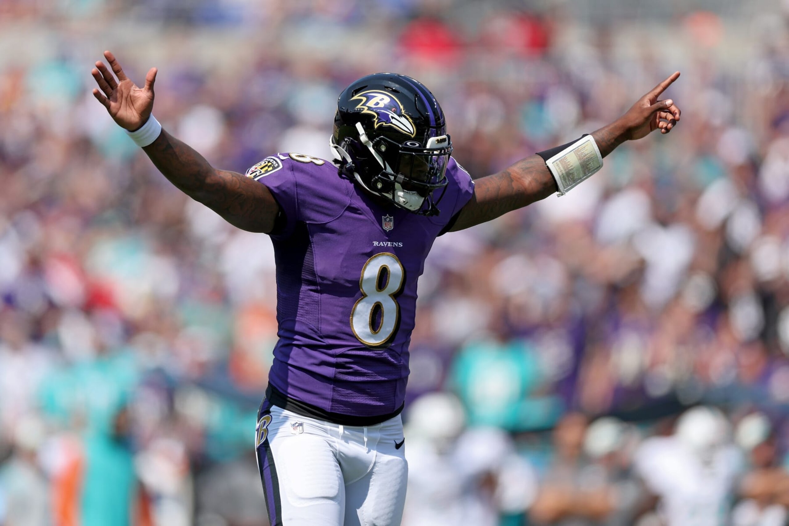 BALTIMORE, MARYLAND - SEPTEMBER 18: Lamar Jackson #8 of the Baltimore Ravens celebrates in the first quarter against the Miami Dolphins at M&T Bank Stadium on September 18, 2022 in Baltimore, Maryland. (Photo by Patrick Smith/Getty Images) BALTIMORE, MARYLAND - SEPTEMBER 18: Lamar Jackson #8 of the Baltimore Ravens celebrates in the first quarter against the Miami Dolphins at M&T Bank Stadium on September 18, 2022 in Baltimore, Maryland. (Photo by Patrick Smith/Getty Images)