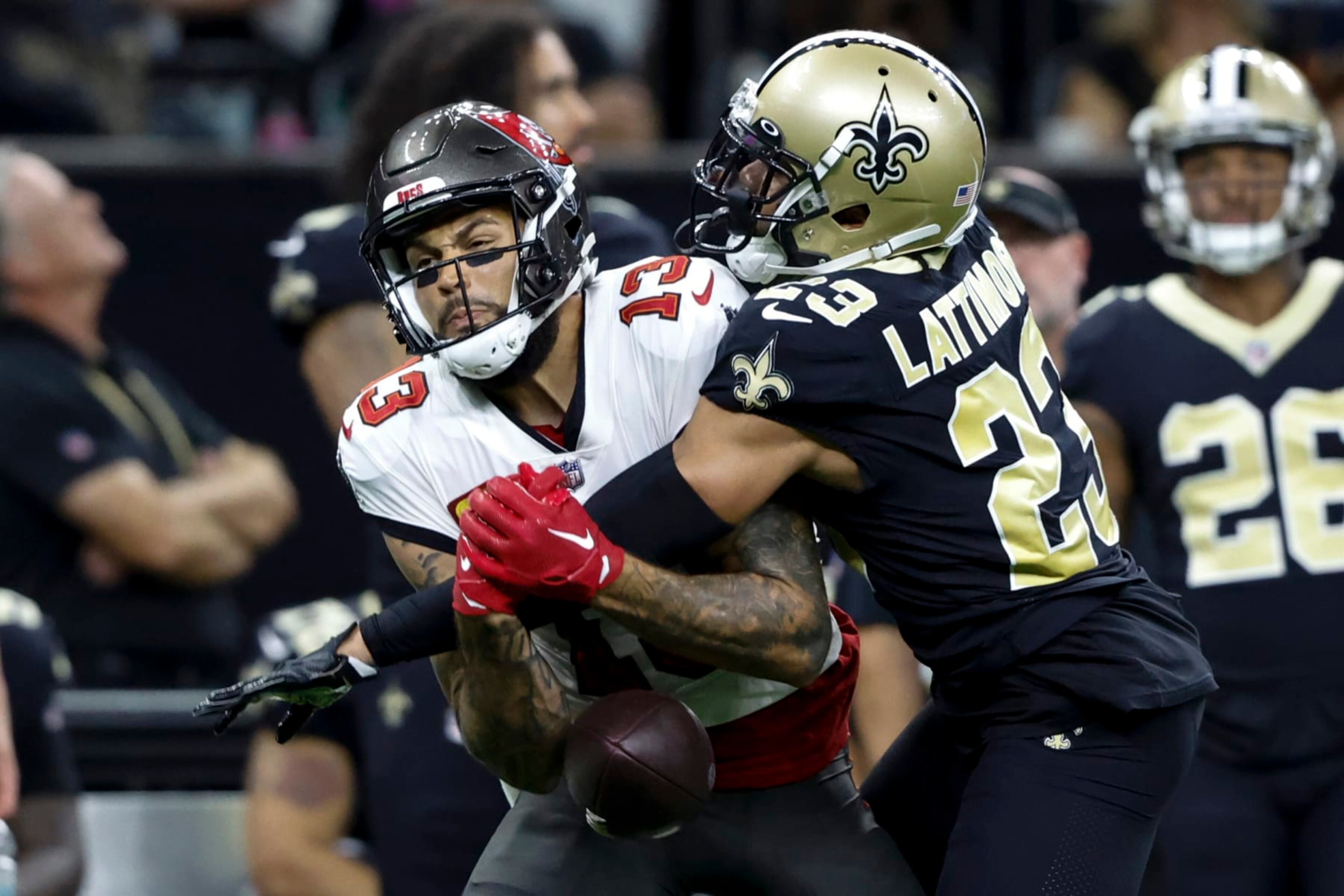New Orleans Saints cornerback Marshon Lattimore breaks up a pass intended for Tampa Bay Buccaneers wide receiver Mike Evans during the first half of an NFL football game in New Orleans, Sunday, Sept. 18, 2022. (AP Photo/Butch Dill) New Orleans Saints cornerback Marshon Lattimore breaks up a pass intended for Tampa Bay Buccaneers wide receiver Mike Evans during the first half of an NFL football game in New Orleans, Sunday, Sept. 18, 2022. (AP Photo/Butch Dill)