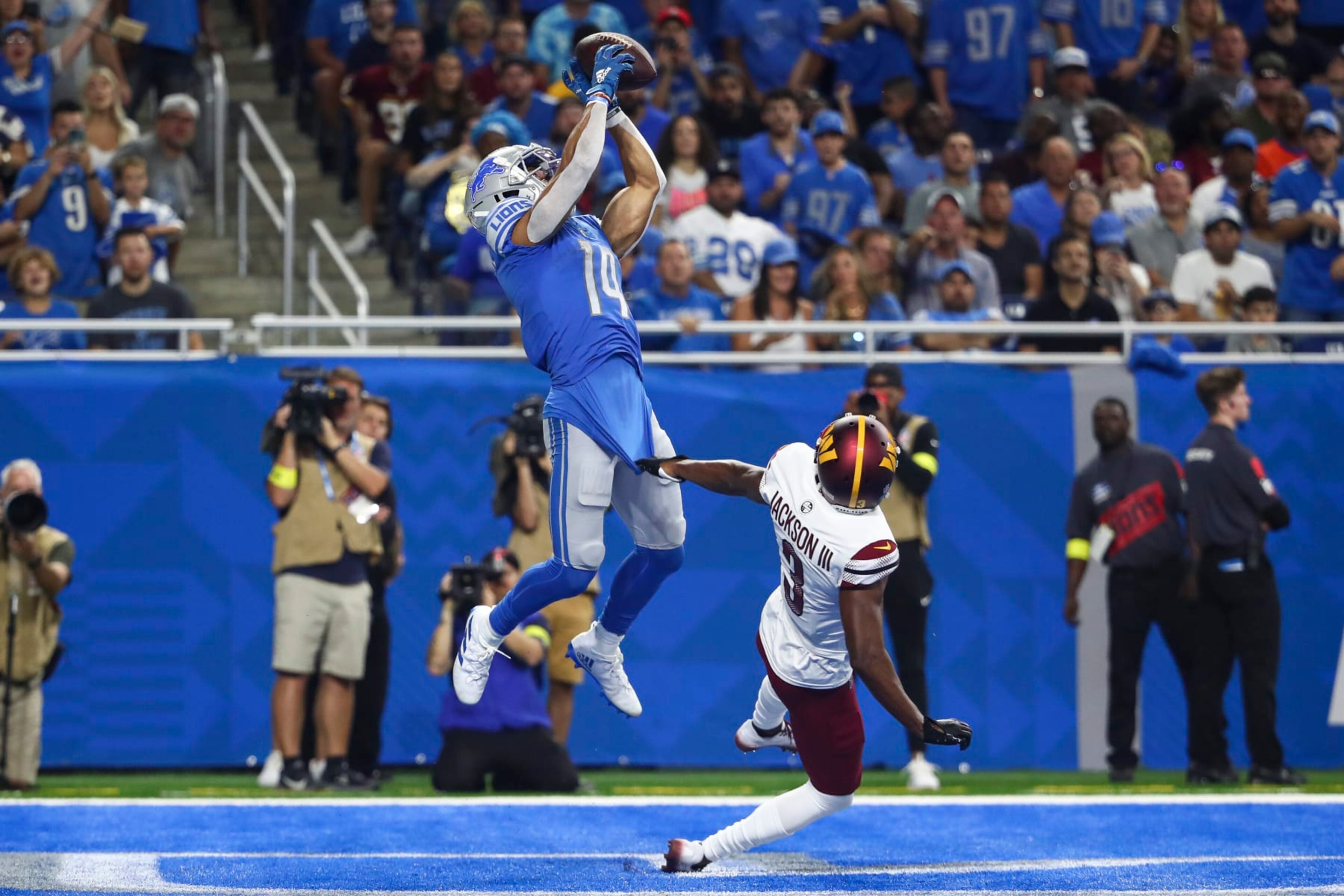 DETROIT, MI - SEPTEMBER 18: Amon-Ra St. Brown #14 of the Detroit Lions catches a pass over William Jackson III #3 of the Washington Commanders for a touchdown during an NFL football game at Ford Field on September 18, 2022 in Detroit, Michigan. (Photo by Kevin Sabitus/Getty Images) DETROIT, MI - SEPTEMBER 18: Amon-Ra St. Brown #14 of the Detroit Lions catches a pass over William Jackson III #3 of the Washington Commanders for a touchdown during an NFL football game at Ford Field on September 18, 2022 in Detroit, Michigan. (Photo by Kevin Sabitus/Getty Images)