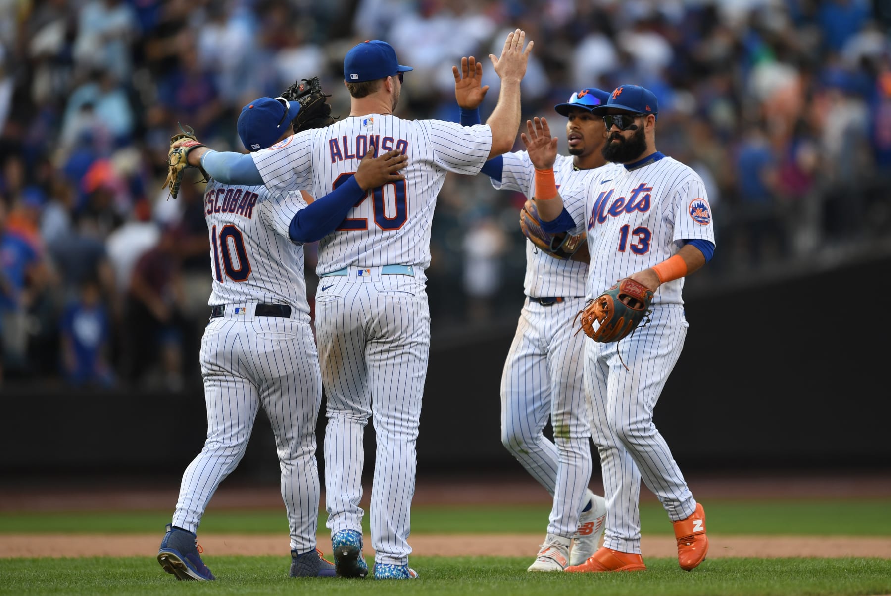NEW YORK, NEW YORK - SEPTEMBER 18: Pete Alonso #20 of the New York Mets celebrates with teammates after defeating the Pittsburgh Pirates at Citi Field on September 18, 2022 in New York City. (Photo by Michael Urakami/Getty Images)