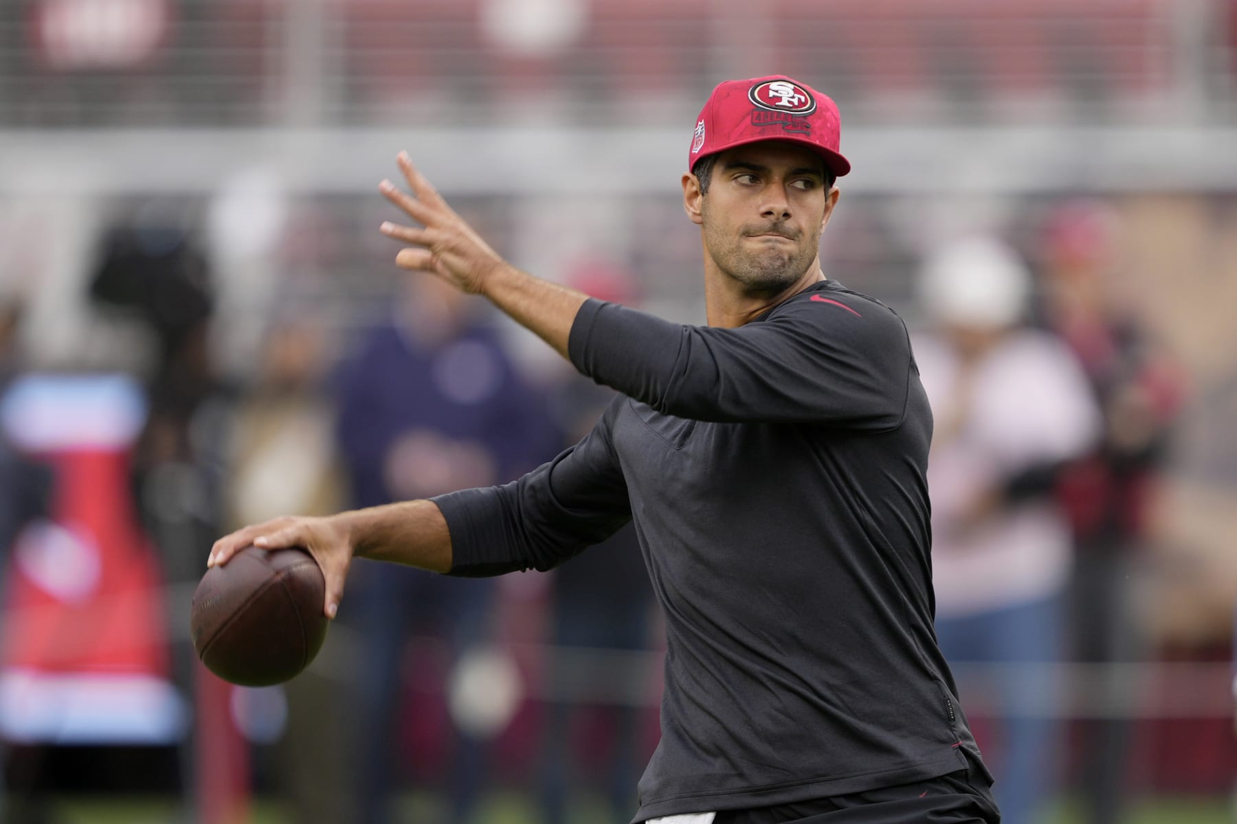 San Francisco 49ers quarterback Jimmy Garoppolo warms up before an NFL football game against the Seattle Seahawks in Santa Clara, Calif., Sunday, Sept. 18, 2022. (AP Photo/Tony Avelar)