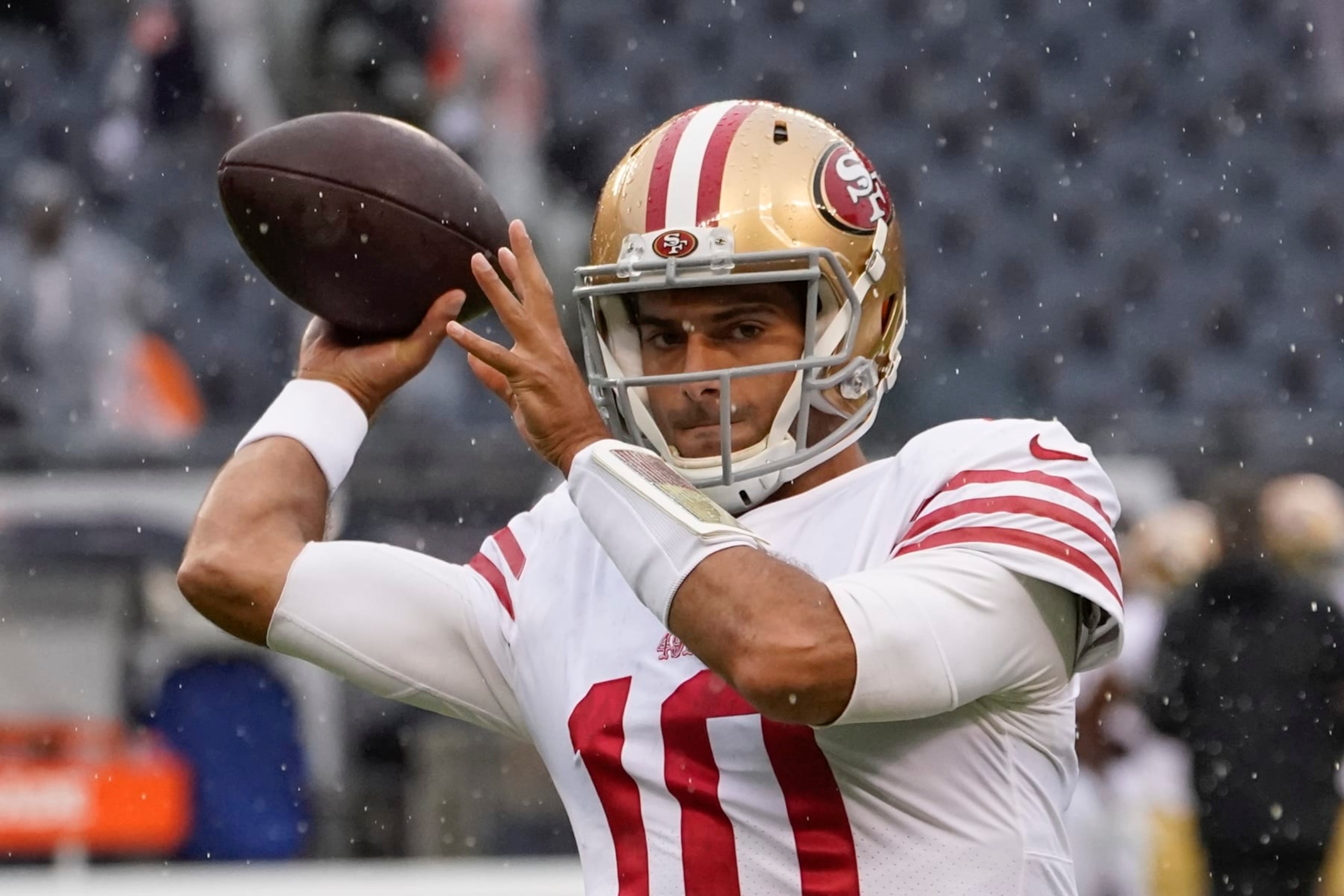 San Francisco 49ers' Jimmy Garoppolo warms up before an NFL football game against the Chicago Bears Sunday, Sept. 11, 2022, in Chicago. (AP Photo/Charles Rex Arbogast)