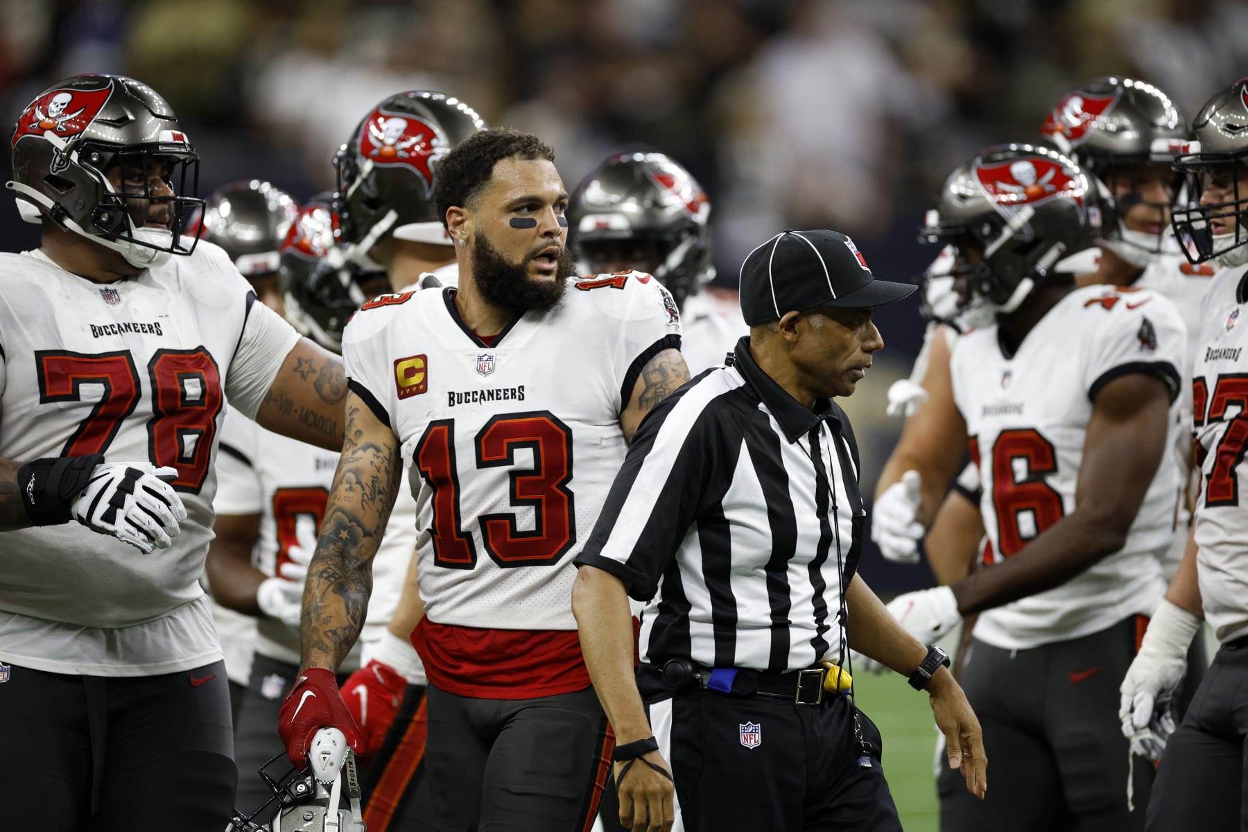 NEW ORLEANS, LOUISIANA - SEPTEMBER 18: Mike Evans #13 of the Tampa Bay Buccaneers looks on after a fight with Marshon Lattimore #23 of the New Orleans Saints at Caesars Superdome on September 18, 2022 in New Orleans, Louisiana. (Photo by Chris Graythen/Getty Images)