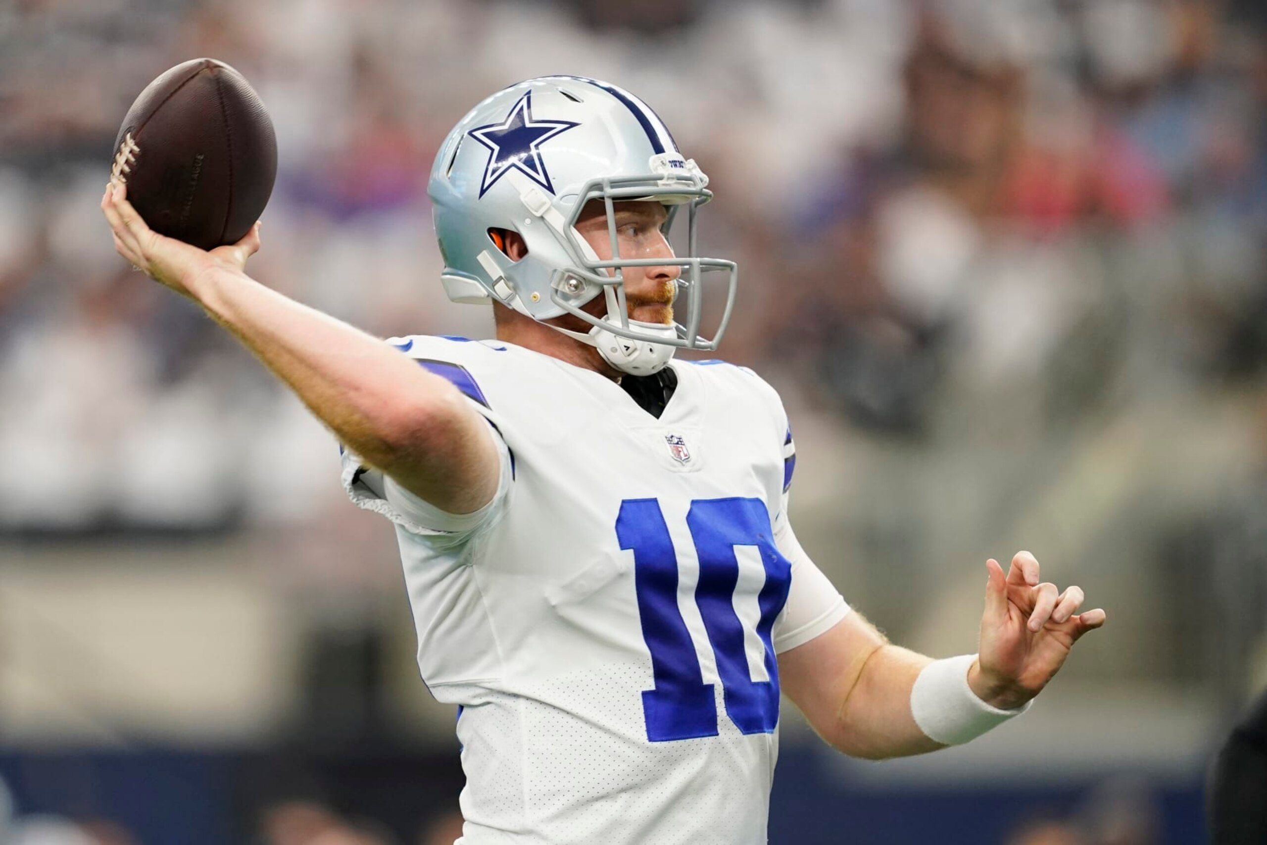 Dallas Cowboys quarterback Cooper Rush (10) tosses a touchdown pass during the first half of an NFL football game Sunday, Sept. 18, 2022, in Arlington, Tx. (AP Photo/Tony Gutierrez)