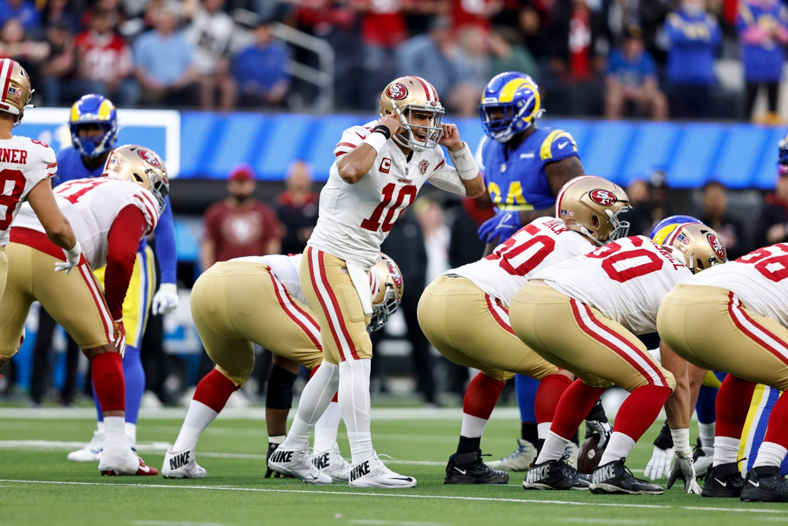 INGLEWOOD, CALIFORNIA - JANUARY 30: Jimmy Garoppolo #10 of the San Francisco 49ers makes a call on the line during the NFC Championship NFL football game against the Los Angeles Rams at SoFi Stadium on January 30, 2022 in Inglewood, California. The Rams won 20-17 to advance to the Super Bowl. (Photo by Michael Owens/Getty Images)