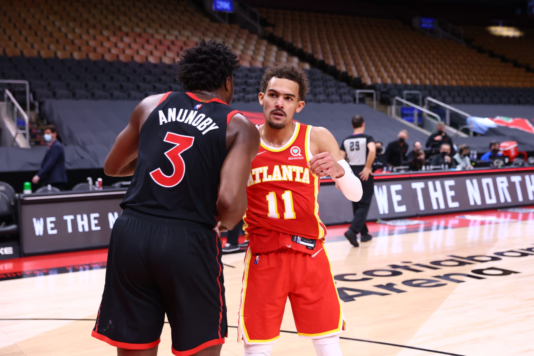 TORONTO, CANADA - FEBRUARY 4: OG Anunoby #3 of the Toronto Raptors and Trae Young #11 of the Atlanta Hawks embrace after the game on February 4, 2022 at the Scotiabank Arena in Toronto, Ontario, Canada.  NOTE TO USER: User expressly acknowledges and agrees that, by downloading and or using this Photograph, user is consenting to the terms and conditions of the Getty Images License Agreement.  Mandatory Copyright Notice: Copyright 2022 NBAE (Photo by Vaughn Ridley/NBAE via Getty Images)