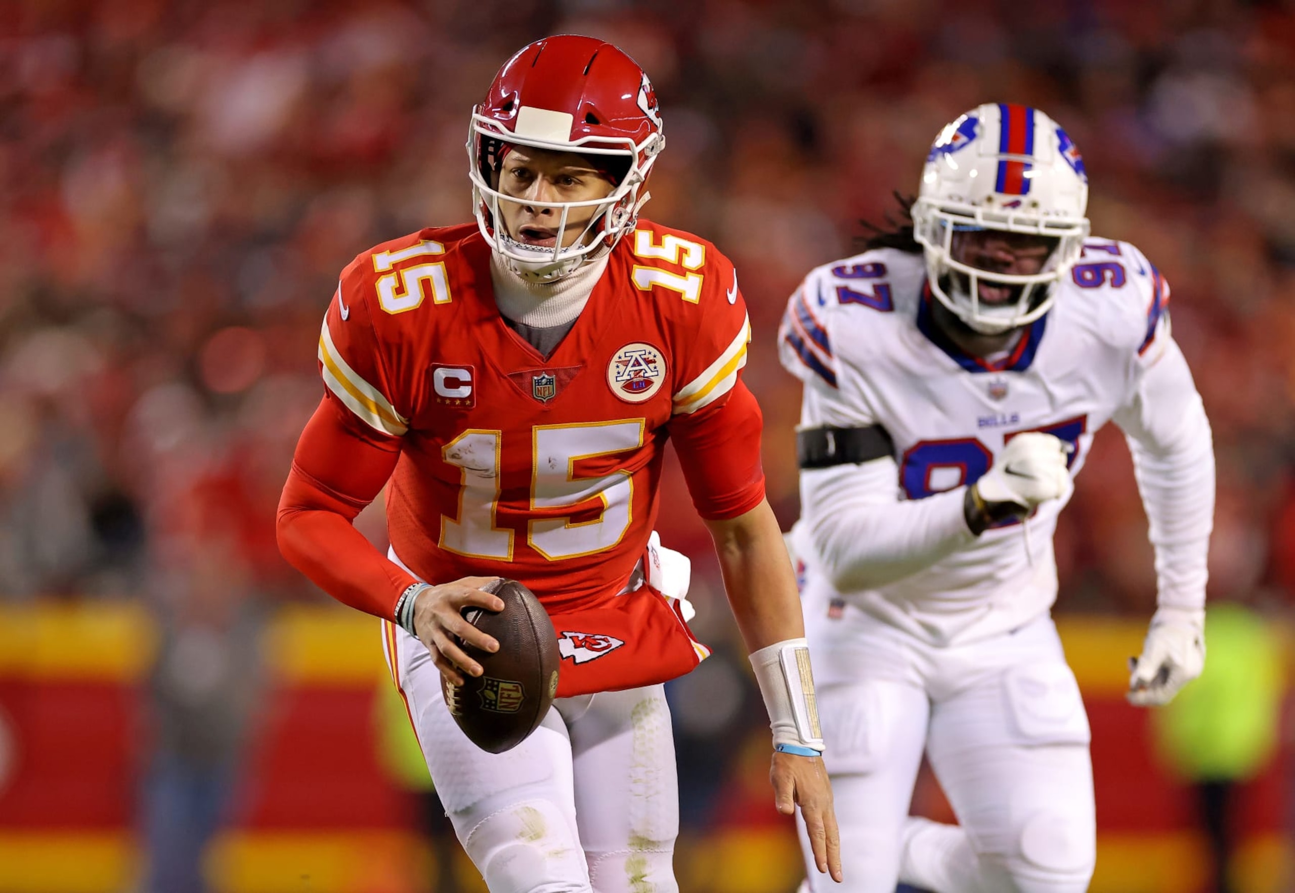 KANSAS CITY, MISSOURI - JANUARY 23: Patrick Mahomes #15 of the Kansas City Chiefs runs the ball for an 8 yard touchdown against the Buffalo Bills during the first quarter in the AFC Divisional Playoff game at Arrowhead Stadium on January 23, 2022 in Kansas City, Missouri. (Photo by David Eulitt/Getty Images) KANSAS CITY, MISSOURI - JANUARY 23: Patrick Mahomes #15 of the Kansas City Chiefs runs the ball for an 8 yard touchdown against the Buffalo Bills during the first quarter in the AFC Divisional Playoff game at Arrowhead Stadium on January 23, 2022 in Kansas City, Missouri. (Photo by David Eulitt/Getty Images)