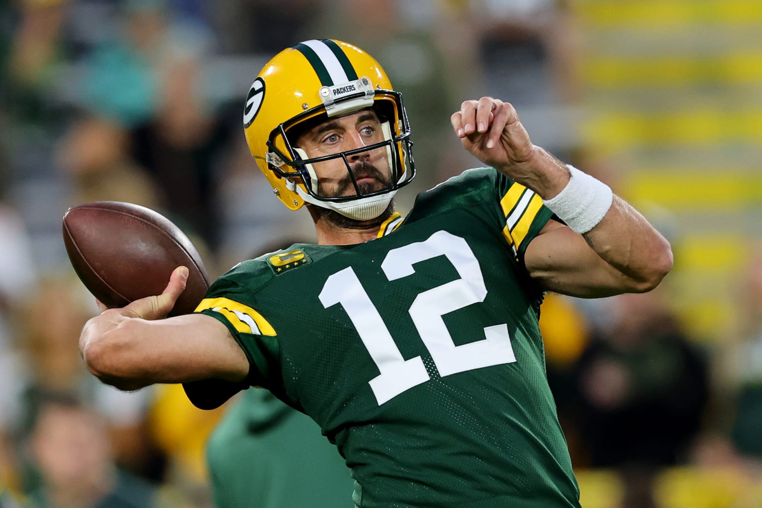 GREEN BAY, WISCONSIN - SEPTEMBER 18: Aaron Rodgers #12 of the Green Bay Packers warms up before the game against the Chicago Bears at Lambeau Field on September 18, 2022 in Green Bay, Wisconsin. (Photo by Michael Reaves/Getty Images)