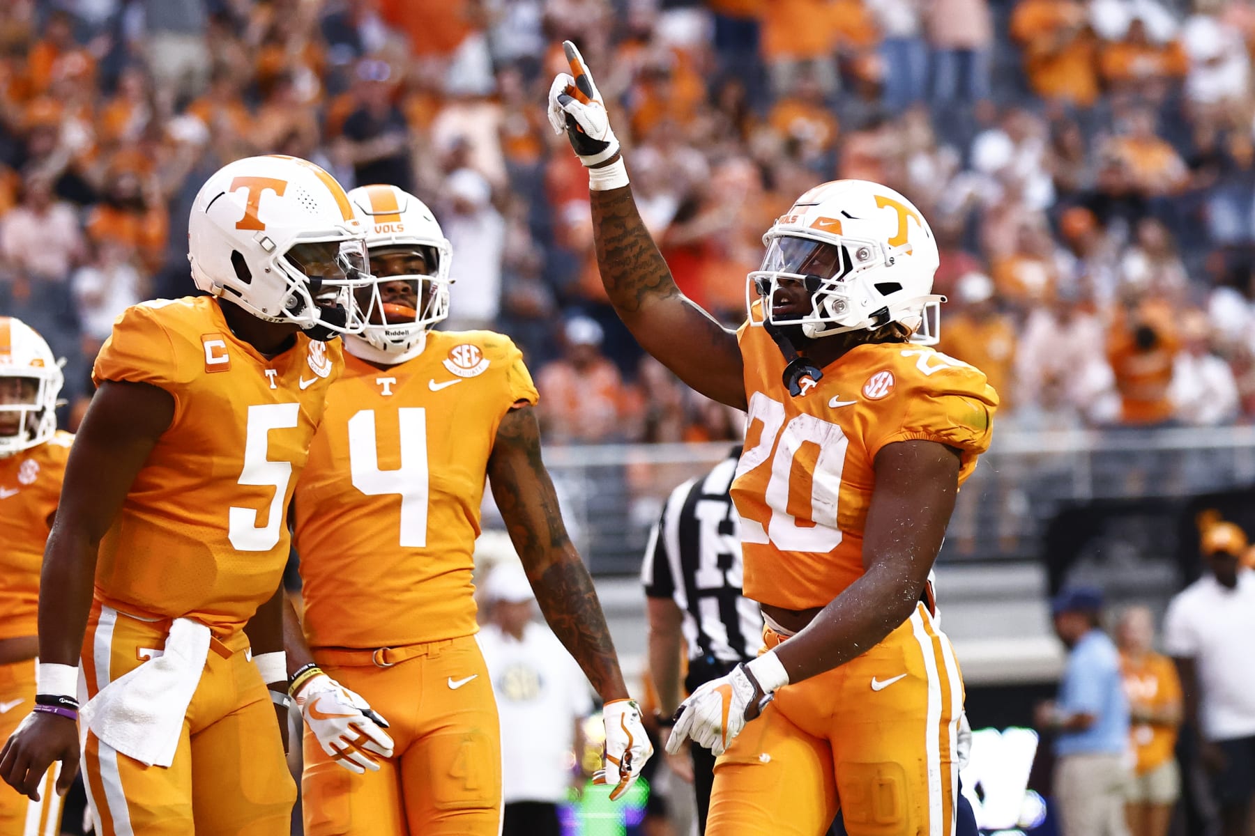 Tennessee running back Jaylen Wright (20) reacts to scoring a touchdown with quarterback Hendon Hooker (5) and wide receiver Cedric Tillman (4) during the first half of an NCAA college football game against Akron, Saturday, Sept. 17, 2022, in Knoxville, Tenn. (AP Photo/Wade Payne)