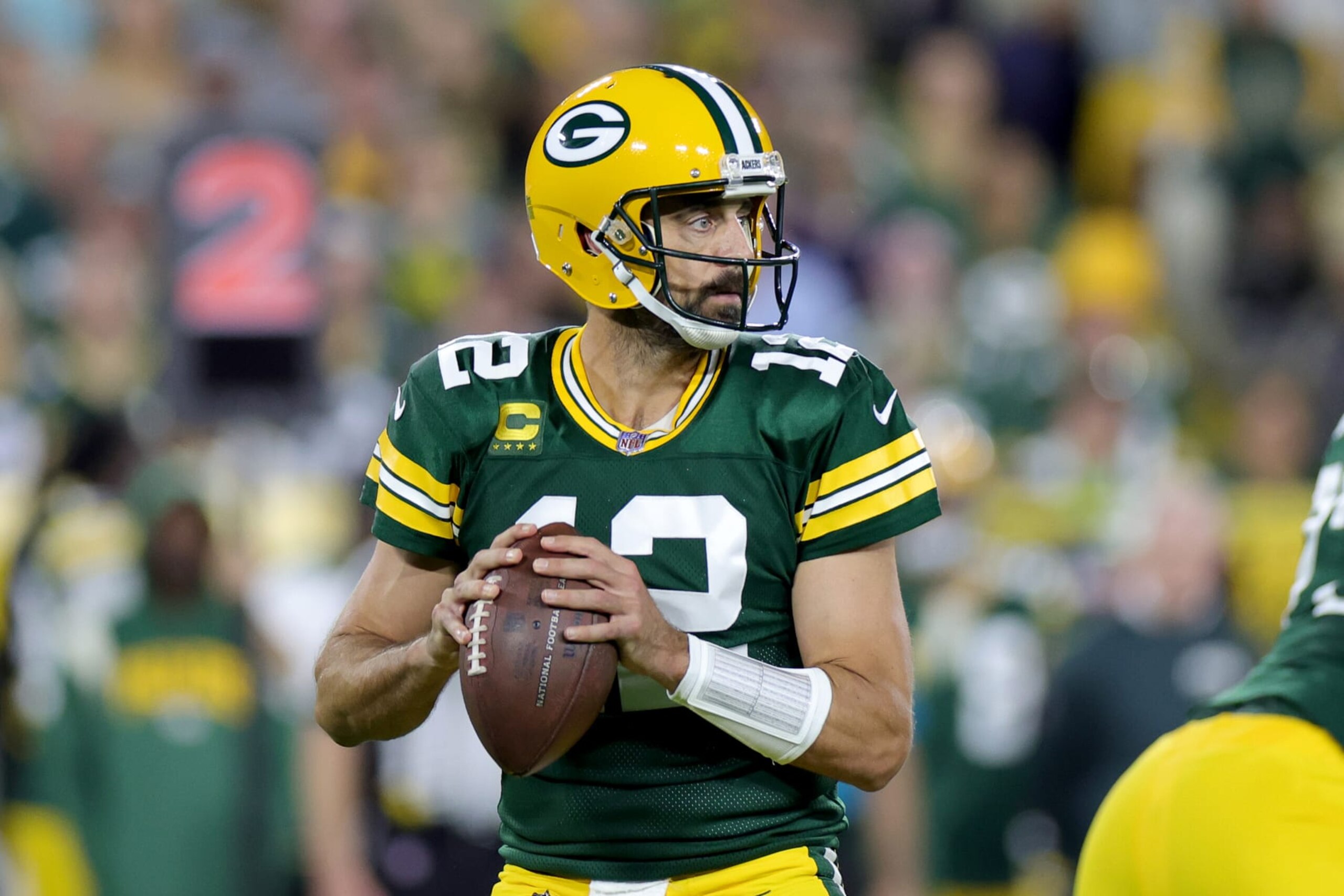 GREEN BAY, WISCONSIN - SEPTEMBER 18: Aaron Rodgers #12 of the Green Bay Packers looks to pass the ball during the first quarter in the game against the Chicago Bears at Lambeau Field on September 18, 2022 in Green Bay, Wisconsin. (Photo by Stacy Revere/Getty Images) GREEN BAY, WISCONSIN - SEPTEMBER 18: Aaron Rodgers #12 of the Green Bay Packers looks to pass the ball during the first quarter in the game against the Chicago Bears at Lambeau Field on September 18, 2022 in Green Bay, Wisconsin. (Photo by Stacy Revere/Getty Images)