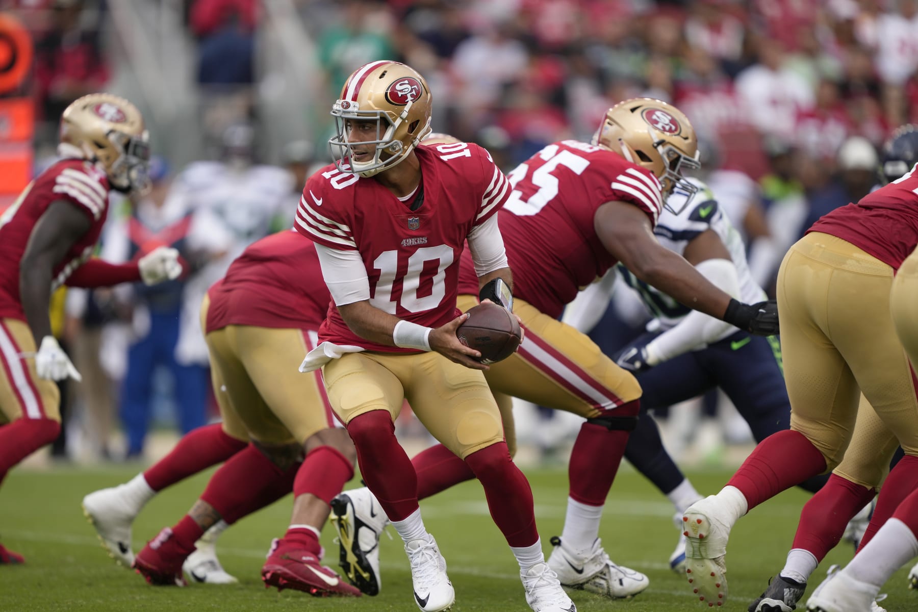 SANTA CLARA, CALIFORNIA - SEPTEMBER 18: Jimmy Garoppolo #10 of the San Francisco 49ers holds the ball after the snap against the Seattle Seahawks during the first half at Levi's Stadium on September 18, 2022 in Santa Clara, California. (Photo by Thearon W. Henderson/Getty Images)