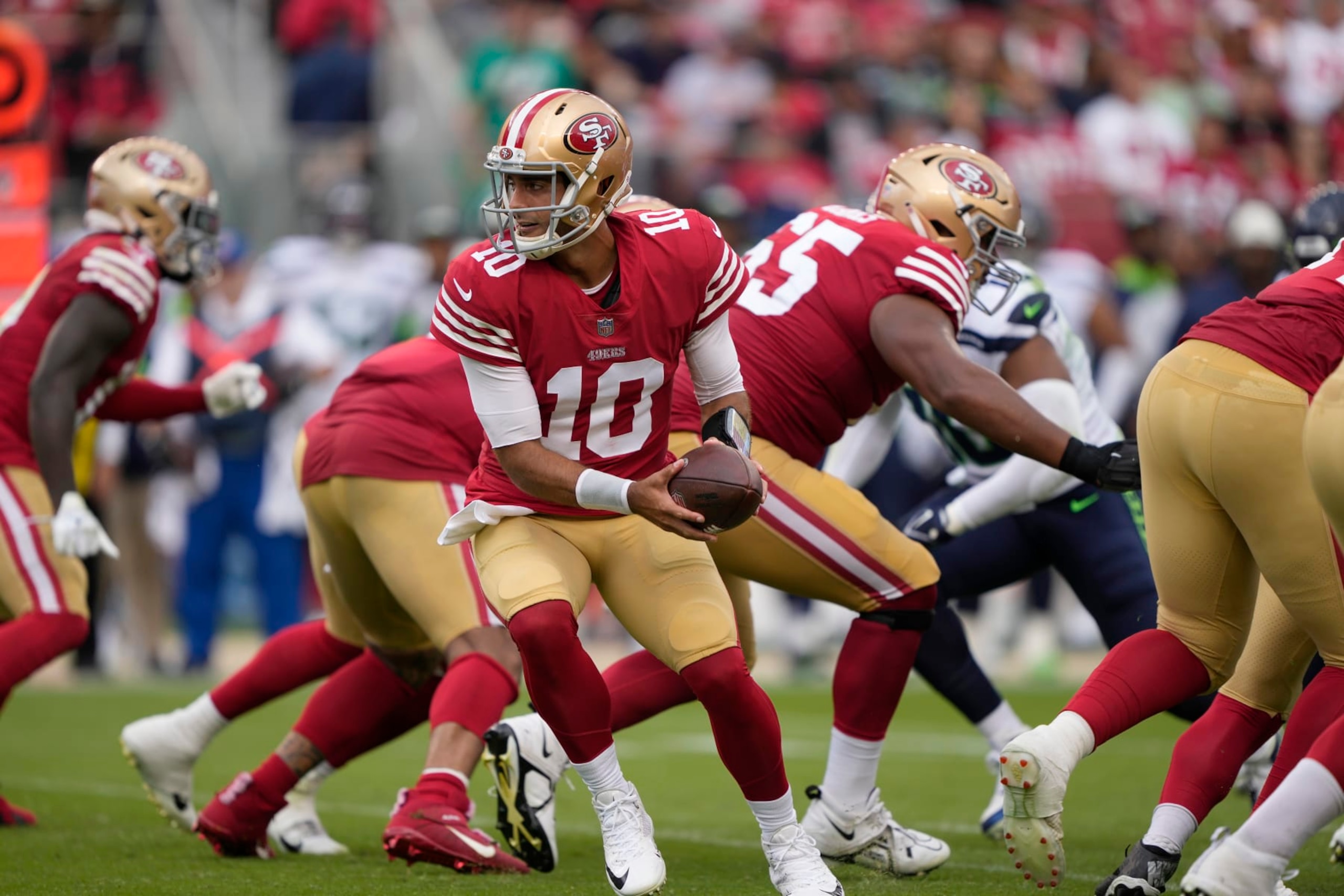 SANTA CLARA, CALIFORNIA - SEPTEMBER 18: Jimmy Garoppolo #10 of the San Francisco 49ers holds the ball after the snap against the Seattle Seahawks during the first half at Levi's Stadium on September 18, 2022 in Santa Clara, California. (Photo by Thearon W. Henderson/Getty Images)