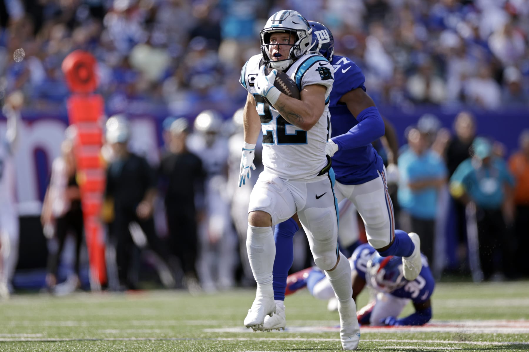 Carolina Panthers running back Christian McCaffrey (22) runs with the ball against the New York Giants during an NFL football game Sunday, Sept. 18, 2022, in East Rutherford, N.J. (AP Photo/Adam Hunger)