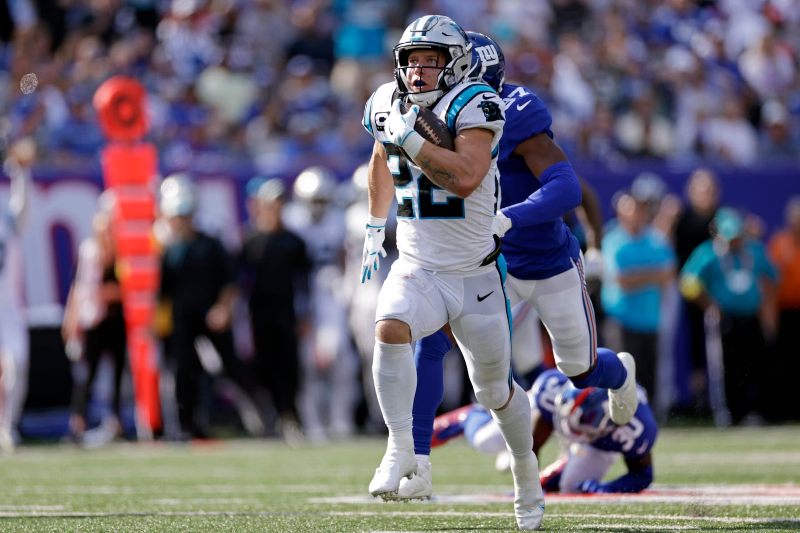 Carolina Panthers running back Christian McCaffrey (22) runs with the ball against the New York Giants during an NFL football game Sunday, Sept. 18, 2022, in East Rutherford, N.J. (AP Photo/Adam Hunger)