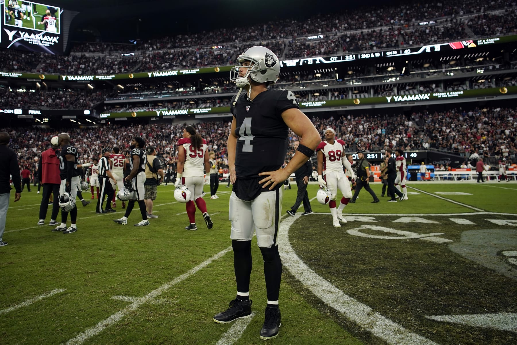 Las Vegas Raiders quarterback Derek Carr (4) stands on the field after an overtime loss to the Arizona Cardinals during an NFL football game Sunday, Sept. 18, 2022, in Las Vegas. (AP Photo/John Locher)