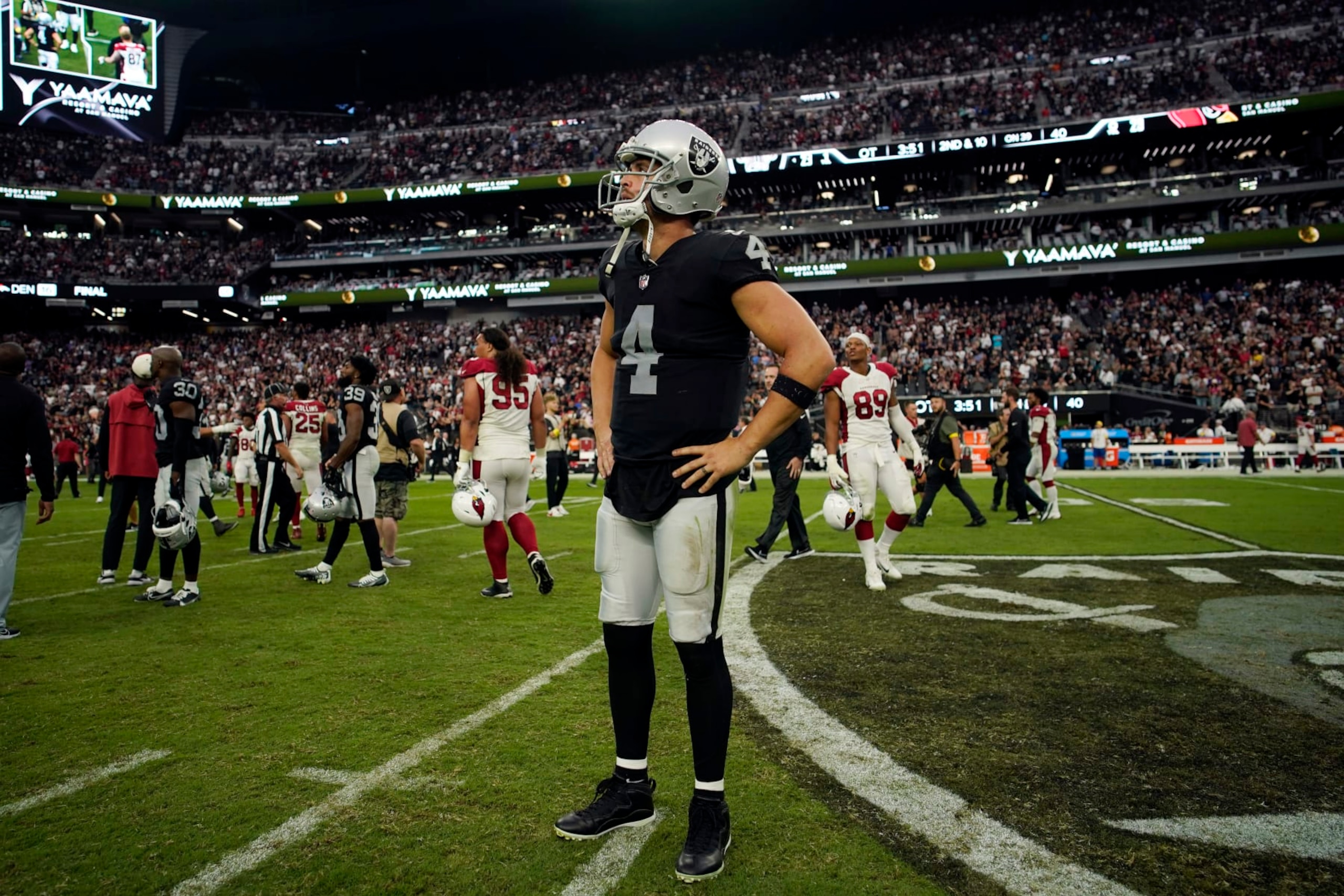 Las Vegas Raiders quarterback Derek Carr (4) stands on the field after an overtime loss to the Arizona Cardinals during an NFL football game Sunday, Sept. 18, 2022, in Las Vegas. (AP Photo/John Locher)