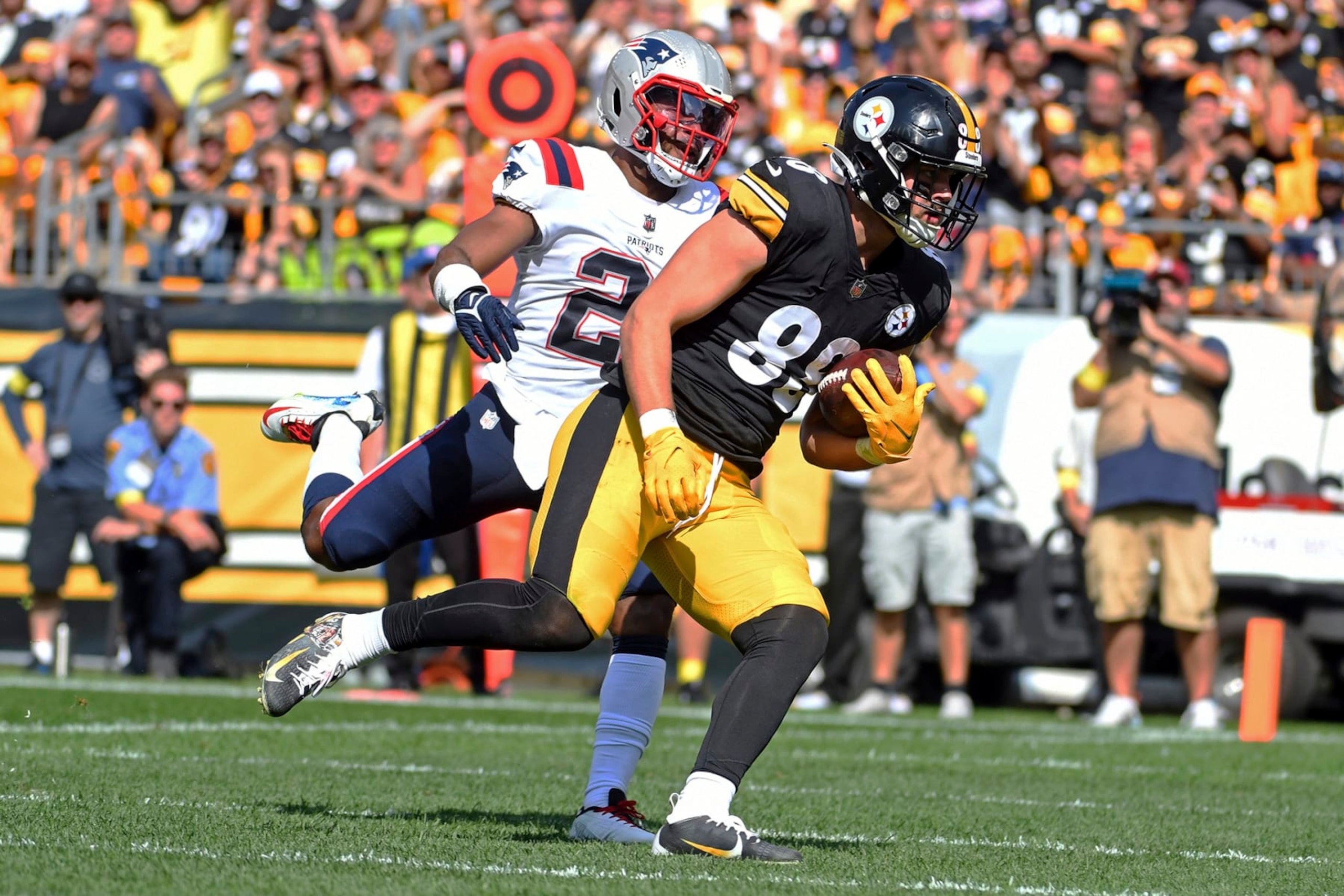 Pittsburgh Steelers tight end Pat Freiermuth (88) scores on a pass from quarterback Mitch Trubisky with New England Patriots safety Adrian Phillips (21) defending during the second half of an NFL football game in Pittsburgh, Sunday, Sept. 18, 2022. (AP Photo/Phil Pavely) Pittsburgh Steelers tight end Pat Freiermuth (88) scores on a pass from quarterback Mitch Trubisky with New England Patriots safety Adrian Phillips (21) defending during the second half of an NFL football game in Pittsburgh, Sunday, Sept. 18, 2022. (AP Photo/Phil Pavely)