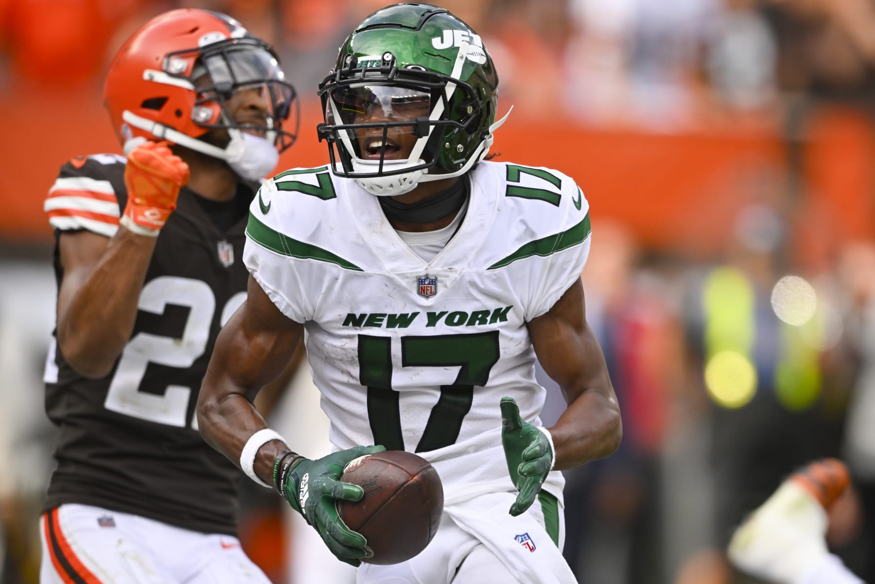 New York Jets wide receiver Garrett Wilson (17) celebrates past Cleveland Browns safety Grant Delpit (22) after scoring a touchdown during the second half of an NFL football game, Sunday, Sept. 18, 2022, in Cleveland. (AP Photo/David Richard)