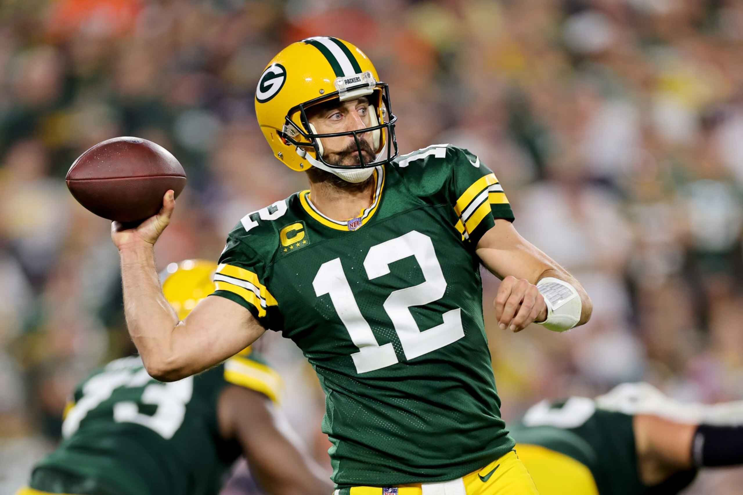 GREEN BAY, WISCONSIN - SEPTEMBER 18: Aaron Rodgers #12 of the Green Bay Packers throws a pass during the third quarter in the game against the Chicago Bears at Lambeau Field on September 18, 2022 in Green Bay, Wisconsin. (Photo by Michael Reaves/Getty Images)