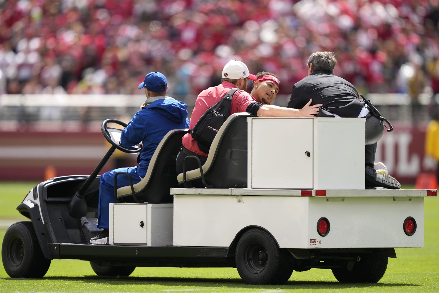 SANTA CLARA, CALIFORNIA - SEPTEMBER 18: Trey Lance #5 of the San Francisco 49ers reacts as he is carted off the field after an apparent injury following a play against the Seattle Seahawks at Levi's Stadium on September 18, 2022 in Santa Clara, California. (Photo by Thearon W. Henderson/Getty Images)