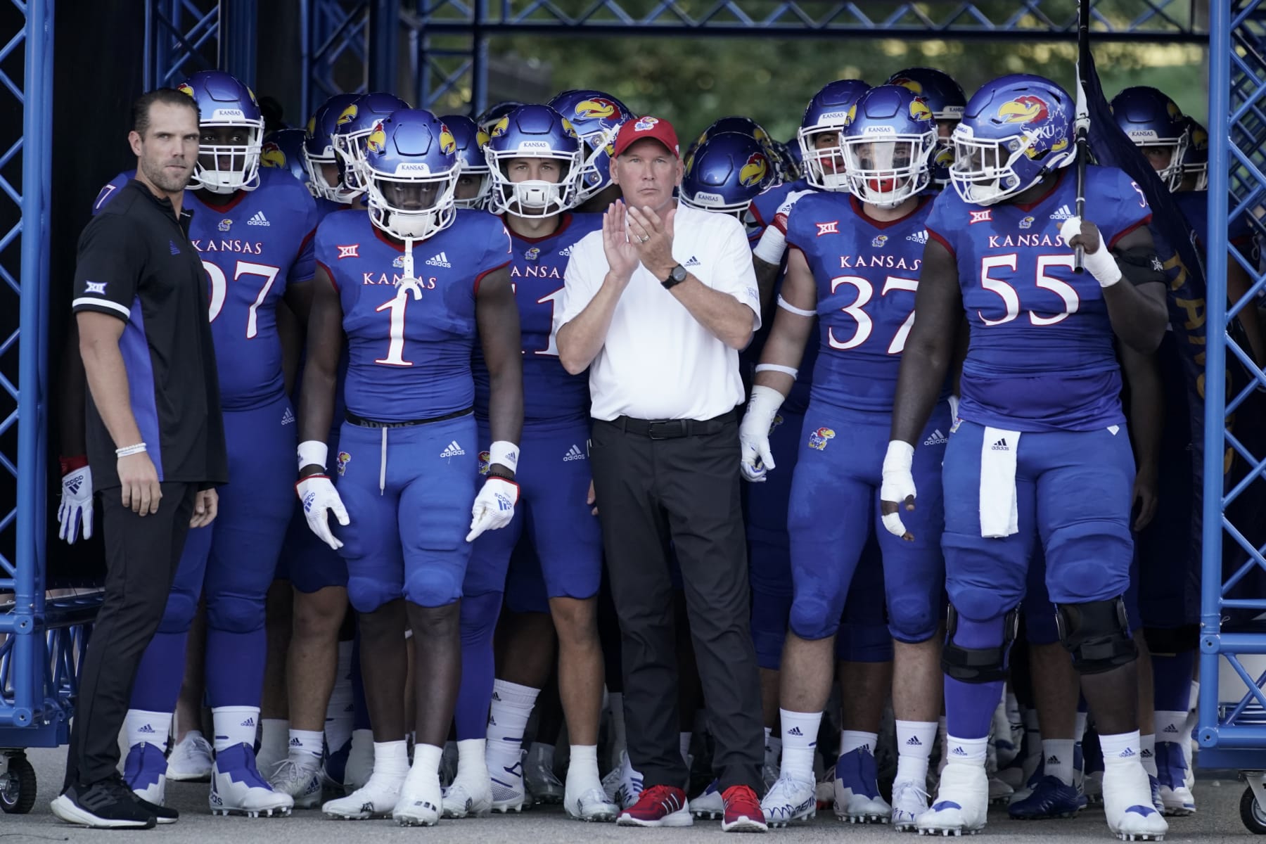 LAWRENCE, KS - SEPTEMBER 02: Head coach Lance Leipold of the Kansas Jayhawks stands with his team prior to a game against the Tennessee Tech Golden Eagles at David Booth Kansas Memorial Stadium on September 2, 2022 in Lawrence, Kansas. (Photo by Ed Zurga/Getty Images) LAWRENCE, KS - SEPTEMBER 02: Head coach Lance Leipold of the Kansas Jayhawks stands with his team prior to a game against the Tennessee Tech Golden Eagles at David Booth Kansas Memorial Stadium on September 2, 2022 in Lawrence, Kansas. (Photo by Ed Zurga/Getty Images)